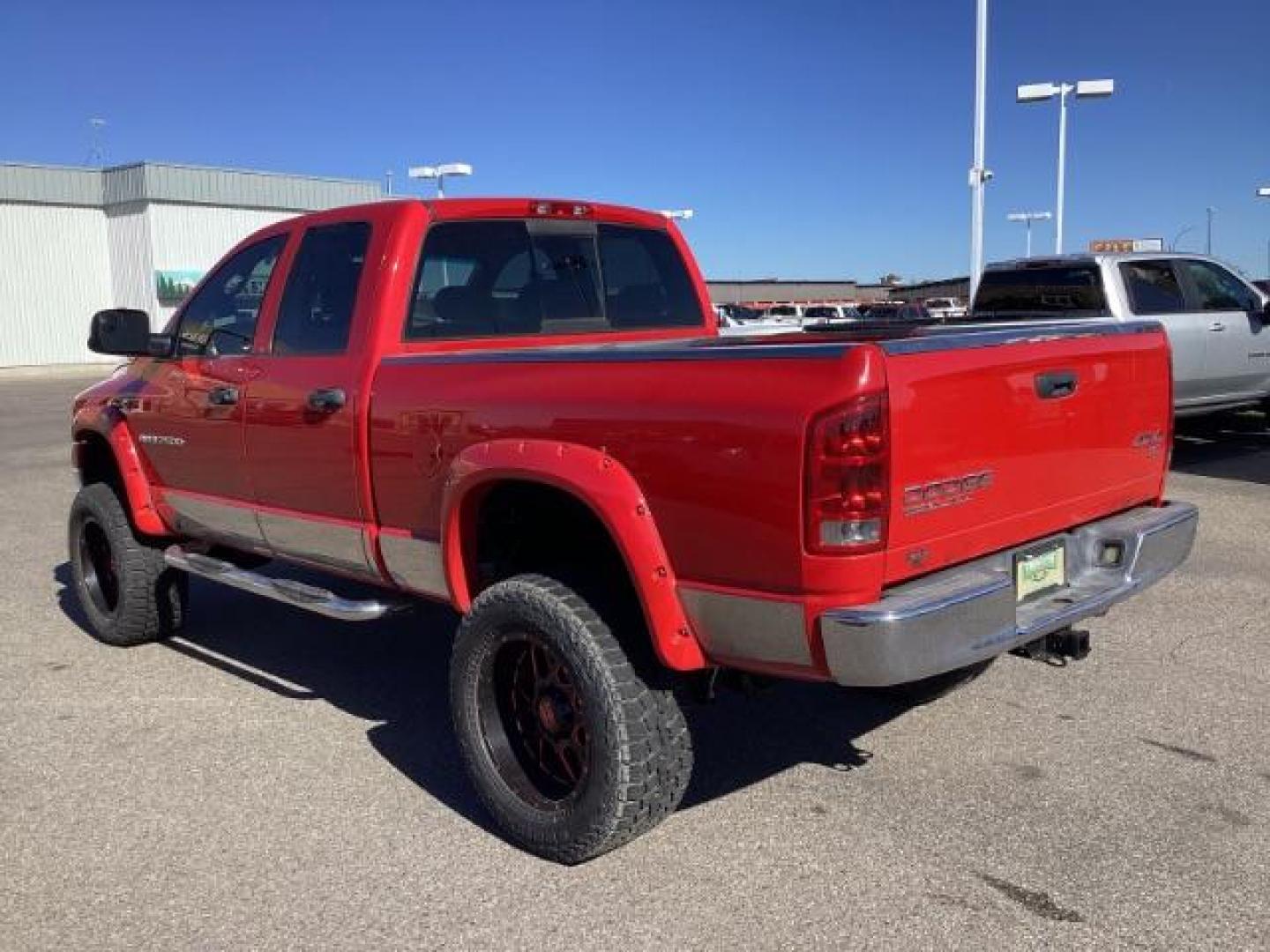 2004 Flame Red /Dark Slate Gray Leather Interior Dodge Ram 2500 SLT Quad Cab 4WD (3D7KU28CX4G) with an 5.9L L6 OHV 24V TURBO DIESEL engine, 5-Speed Automatic transmission, located at 1235 N Woodruff Ave., Idaho Falls, 83401, (208) 523-1053, 43.507172, -112.000488 - The 2004 Dodge Ram 2500 Quad Cab SLT Diesel is a robust and capable truck known for its towing capacity and durability. Here are some of the key features you might find on this model: Engine: Equipped with a powerful and torquey Cummins 5.9-liter inline-six turbocharged diesel engine, known for its - Photo#2