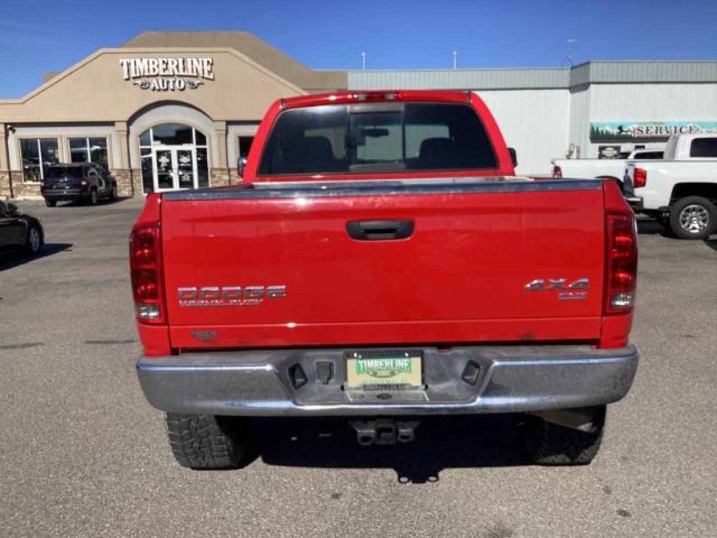 2004 Flame Red /Dark Slate Gray Leather Interior Dodge Ram 2500 SLT Quad Cab 4WD (3D7KU28CX4G) with an 5.9L L6 OHV 24V TURBO DIESEL engine, 5-Speed Automatic transmission, located at 1235 N Woodruff Ave., Idaho Falls, 83401, (208) 523-1053, 43.507172, -112.000488 - The 2004 Dodge Ram 2500 Quad Cab SLT Diesel is a robust and capable truck known for its towing capacity and durability. Here are some of the key features you might find on this model: Engine: Equipped with a powerful and torquey Cummins 5.9-liter inline-six turbocharged diesel engine, known for its - Photo#3