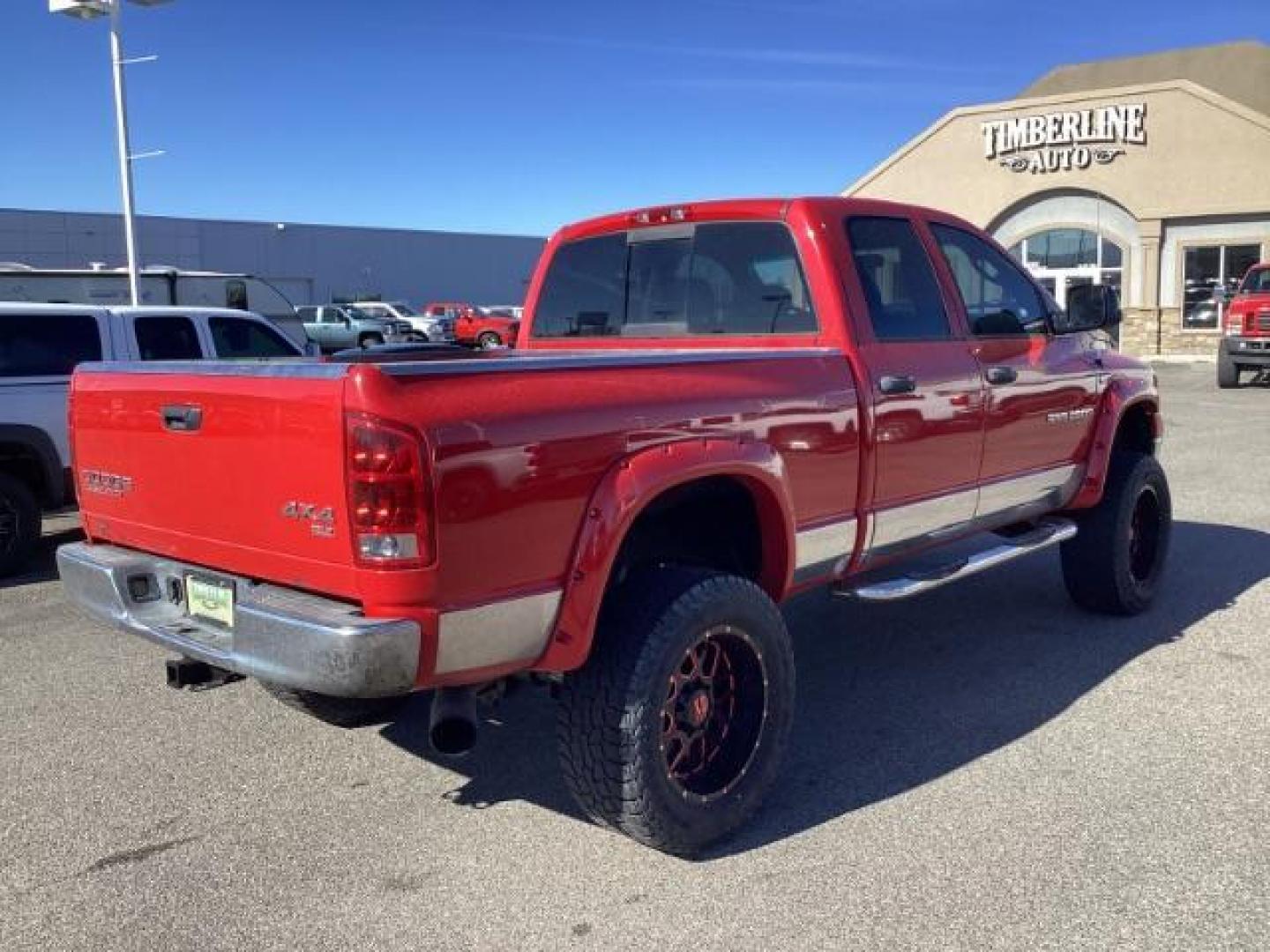 2004 Flame Red /Dark Slate Gray Leather Interior Dodge Ram 2500 SLT Quad Cab 4WD (3D7KU28CX4G) with an 5.9L L6 OHV 24V TURBO DIESEL engine, 5-Speed Automatic transmission, located at 1235 N Woodruff Ave., Idaho Falls, 83401, (208) 523-1053, 43.507172, -112.000488 - The 2004 Dodge Ram 2500 Quad Cab SLT Diesel is a robust and capable truck known for its towing capacity and durability. Here are some of the key features you might find on this model: Engine: Equipped with a powerful and torquey Cummins 5.9-liter inline-six turbocharged diesel engine, known for its - Photo#4