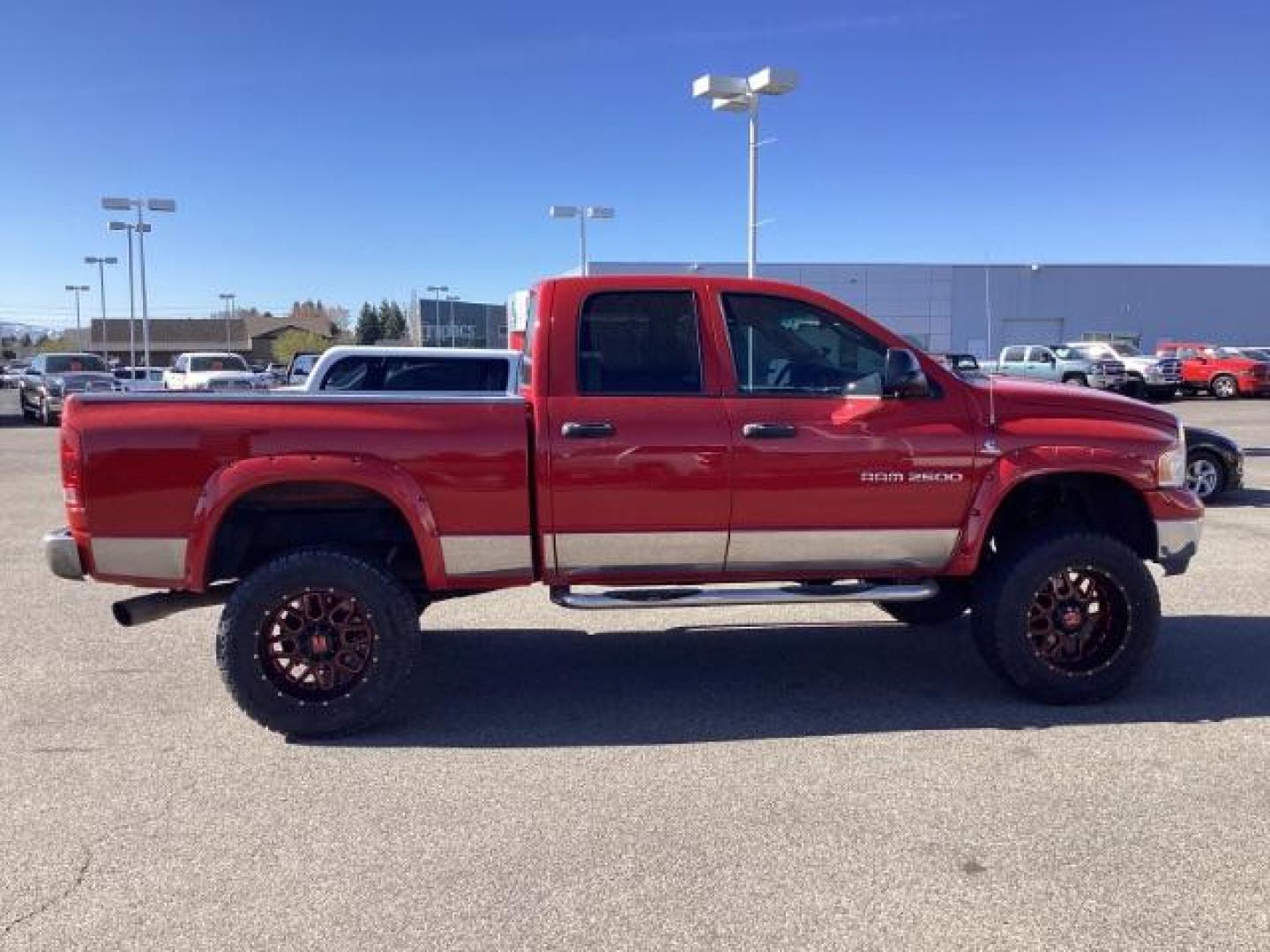 2004 Flame Red /Dark Slate Gray Leather Interior Dodge Ram 2500 SLT Quad Cab 4WD (3D7KU28CX4G) with an 5.9L L6 OHV 24V TURBO DIESEL engine, 5-Speed Automatic transmission, located at 1235 N Woodruff Ave., Idaho Falls, 83401, (208) 523-1053, 43.507172, -112.000488 - The 2004 Dodge Ram 2500 Quad Cab SLT Diesel is a robust and capable truck known for its towing capacity and durability. Here are some of the key features you might find on this model: Engine: Equipped with a powerful and torquey Cummins 5.9-liter inline-six turbocharged diesel engine, known for its - Photo#5