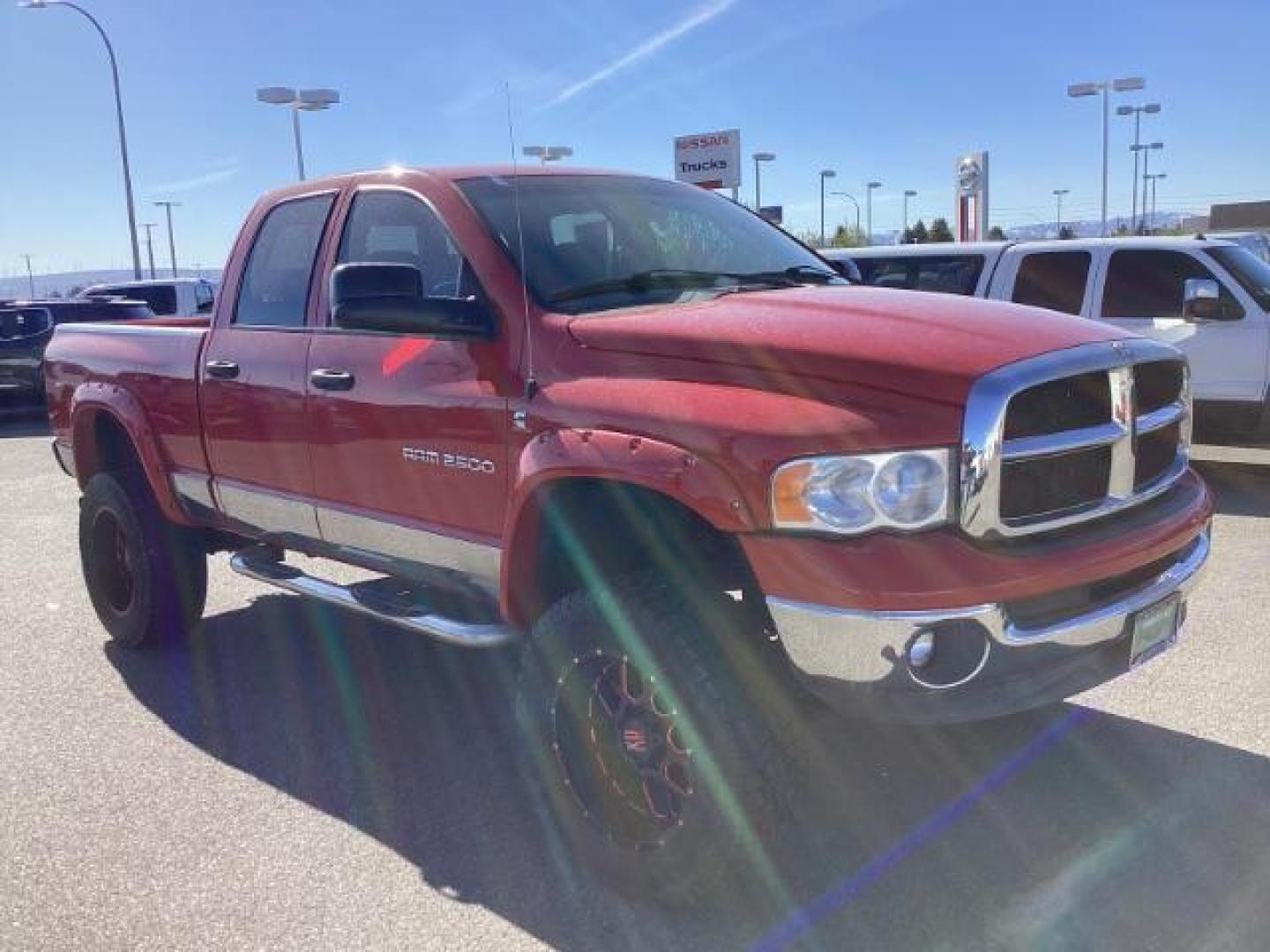 2004 Flame Red /Dark Slate Gray Leather Interior Dodge Ram 2500 SLT Quad Cab 4WD (3D7KU28CX4G) with an 5.9L L6 OHV 24V TURBO DIESEL engine, 5-Speed Automatic transmission, located at 1235 N Woodruff Ave., Idaho Falls, 83401, (208) 523-1053, 43.507172, -112.000488 - The 2004 Dodge Ram 2500 Quad Cab SLT Diesel is a robust and capable truck known for its towing capacity and durability. Here are some of the key features you might find on this model: Engine: Equipped with a powerful and torquey Cummins 5.9-liter inline-six turbocharged diesel engine, known for its - Photo#6