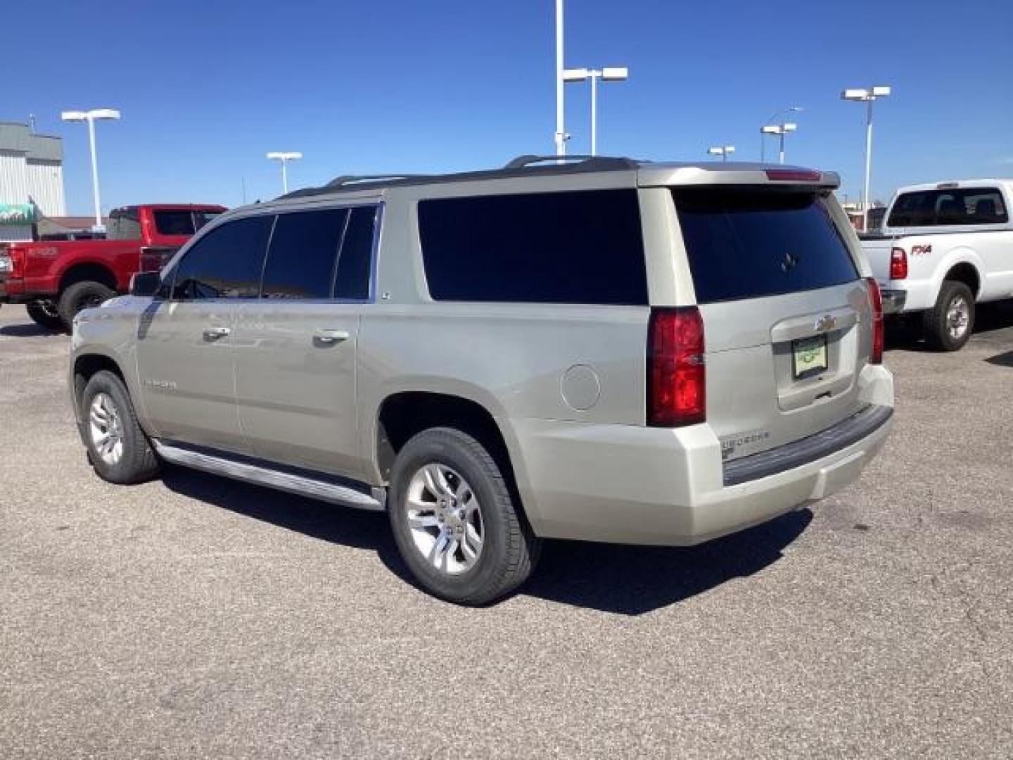 2015 SILVER /LEATHER Chevrolet Suburban LT 1500 4WD (1GNSKJKC5FR) with an 5.3L V8 OHV 16V engine, 6-Speed Automatic transmission, located at 1235 N Woodruff Ave., Idaho Falls, 83401, (208) 523-1053, 43.507172, -112.000488 - The 2015 Chevrolet Suburban LT is a well-equipped trim level of the full-size SUV, offering a range of features designed to provide comfort, convenience, safety, and performance. Here are some of the notable features you might find on the 2015 Chevy Suburban LT: V8 Engine: The Suburban LT typically - Photo#2