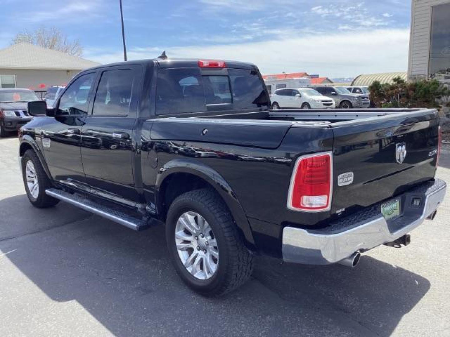 2017 BLACK /Black/Cattle Tan, premium leather RAM 1500 Longhorn Crew Cab SWB 4WD (1C6RR7PT9HS) with an 5.7L V8 OHV 16V engine, 8-Speed Automatic transmission, located at 1235 N Woodruff Ave., Idaho Falls, 83401, (208) 523-1053, 43.507172, -112.000488 - The 2017 Ram 1500 Laramie Longhorn with the 5.7-liter HEMI V8 engine offers a blend of luxury, capability, and performance. Here are the key features you might find on this specific configuration: Does have a rebuilt title 5.7-liter HEMI V8 Engine: Produces 395 horsepower and 410 lb-ft of torque, pr - Photo#2