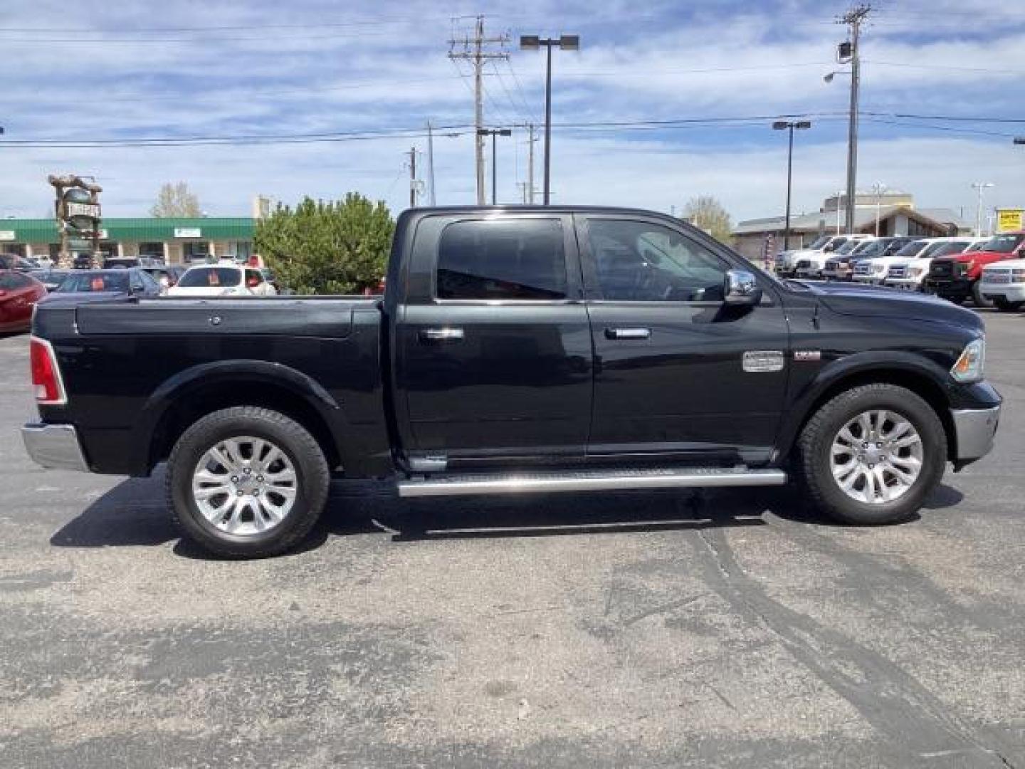 2017 BLACK /Black/Cattle Tan, premium leather RAM 1500 Longhorn Crew Cab SWB 4WD (1C6RR7PT9HS) with an 5.7L V8 OHV 16V engine, 8-Speed Automatic transmission, located at 1235 N Woodruff Ave., Idaho Falls, 83401, (208) 523-1053, 43.507172, -112.000488 - The 2017 Ram 1500 Laramie Longhorn with the 5.7-liter HEMI V8 engine offers a blend of luxury, capability, and performance. Here are the key features you might find on this specific configuration: Does have a rebuilt title 5.7-liter HEMI V8 Engine: Produces 395 horsepower and 410 lb-ft of torque, pr - Photo#5