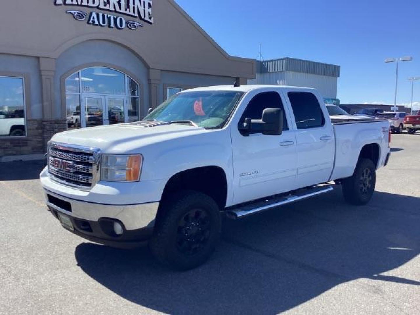 2013 Summit White /Ebony Leather Interior GMC Sierra 2500HD SLT Crew Cab 4WD (1GT121E86DF) with an 6.6L V8 OHV 32V TURBO DIESEL engine, 6-Speed Automatic transmission, located at 1235 N Woodruff Ave., Idaho Falls, 83401, (208) 523-1053, 43.507172, -112.000488 - New Inventory. Going thru service and inspection. Call for more pictures. At Timberline Auto it is always easy to find a great deal on your next vehicle! Our experienced sales staff can help find the right vehicle that will fit your needs. Our knowledgeable finance department has options for almost - Photo#1