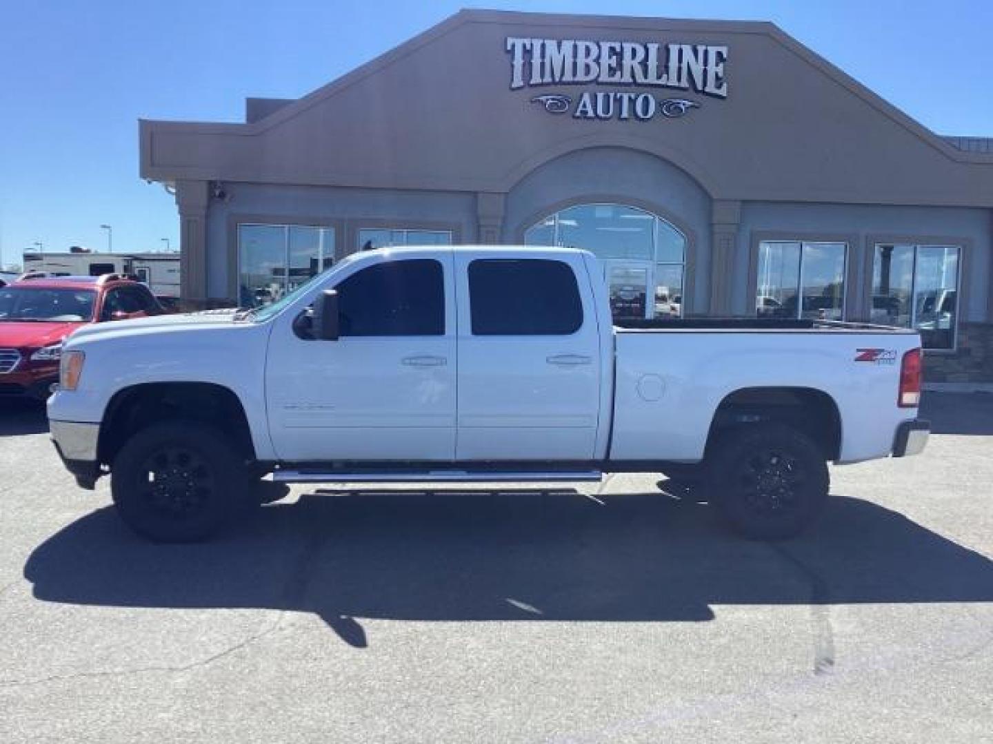 2013 Summit White /Ebony Leather Interior GMC Sierra 2500HD SLT Crew Cab 4WD (1GT121E86DF) with an 6.6L V8 OHV 32V TURBO DIESEL engine, 6-Speed Automatic transmission, located at 1235 N Woodruff Ave., Idaho Falls, 83401, (208) 523-1053, 43.507172, -112.000488 - New Inventory. Going thru service and inspection. Call for more pictures. At Timberline Auto it is always easy to find a great deal on your next vehicle! Our experienced sales staff can help find the right vehicle that will fit your needs. Our knowledgeable finance department has options for almost - Photo#1