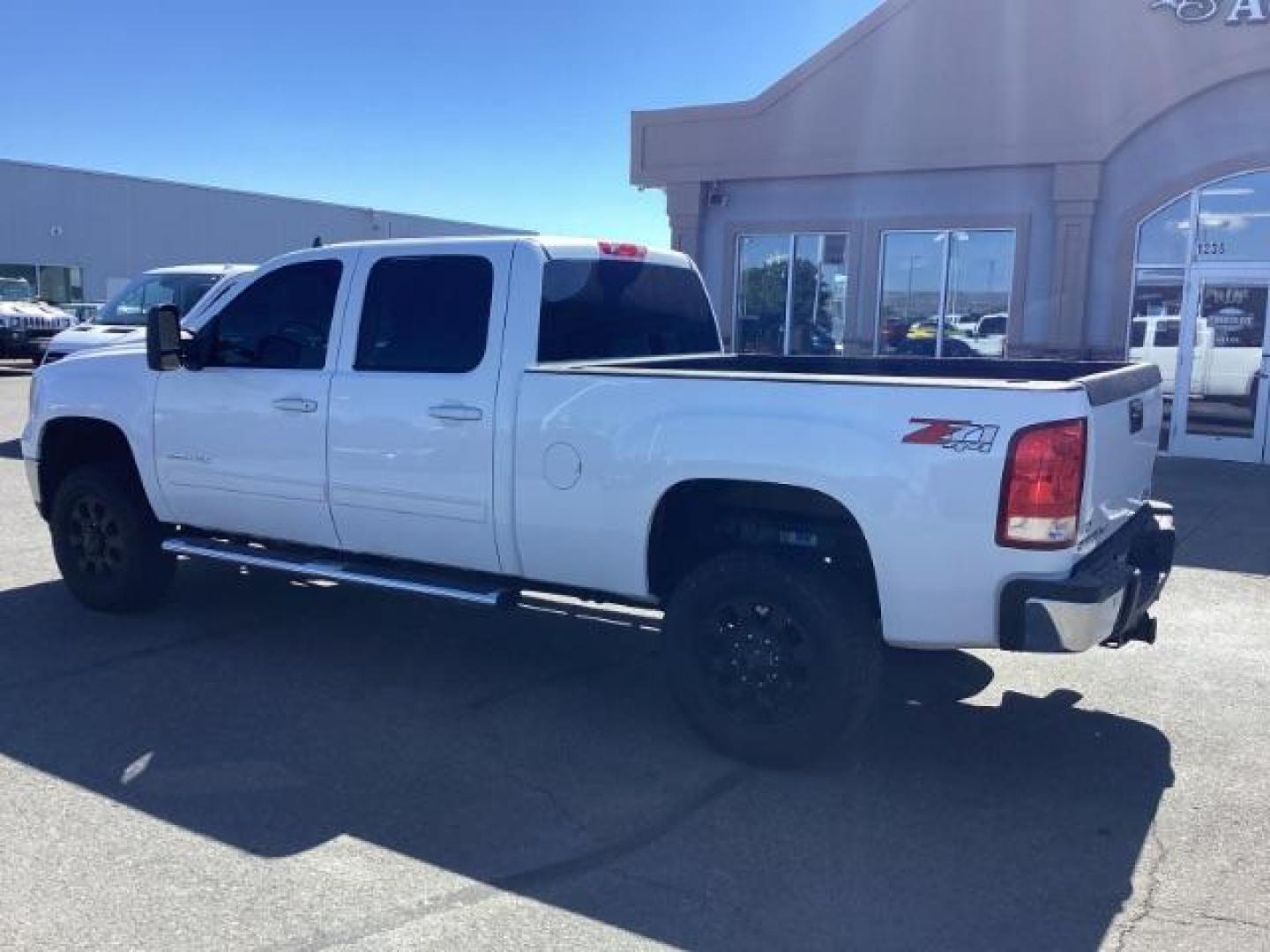 2013 Summit White /Ebony Leather Interior GMC Sierra 2500HD SLT Crew Cab 4WD (1GT121E86DF) with an 6.6L V8 OHV 32V TURBO DIESEL engine, 6-Speed Automatic transmission, located at 1235 N Woodruff Ave., Idaho Falls, 83401, (208) 523-1053, 43.507172, -112.000488 - New Inventory. Going thru service and inspection. Call for more pictures. At Timberline Auto it is always easy to find a great deal on your next vehicle! Our experienced sales staff can help find the right vehicle that will fit your needs. Our knowledgeable finance department has options for almost - Photo#3