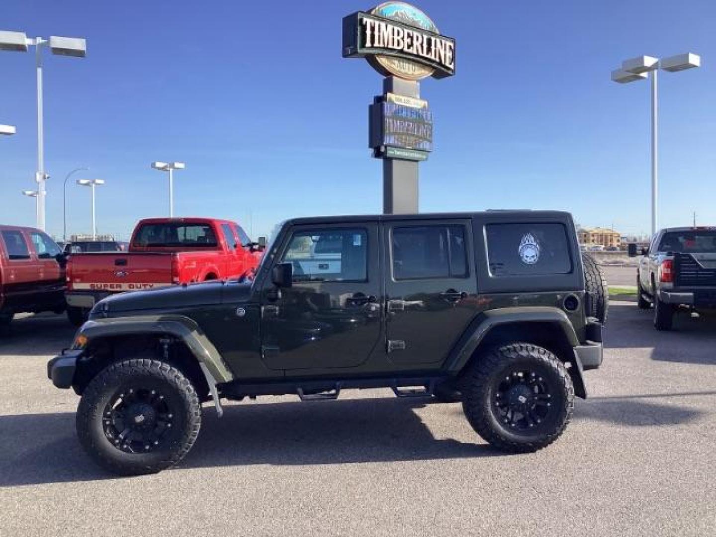 2015 GREEN /Black, cloth Jeep Wrangler Unlimited Sahara 4WD (1C4BJWEG9FL) with an 3.6L V6 DOHC 24V FFV engine, 5-Speed Automatic transmission, located at 1235 N Woodruff Ave., Idaho Falls, 83401, (208) 523-1053, 43.507172, -112.000488 - Photo#1