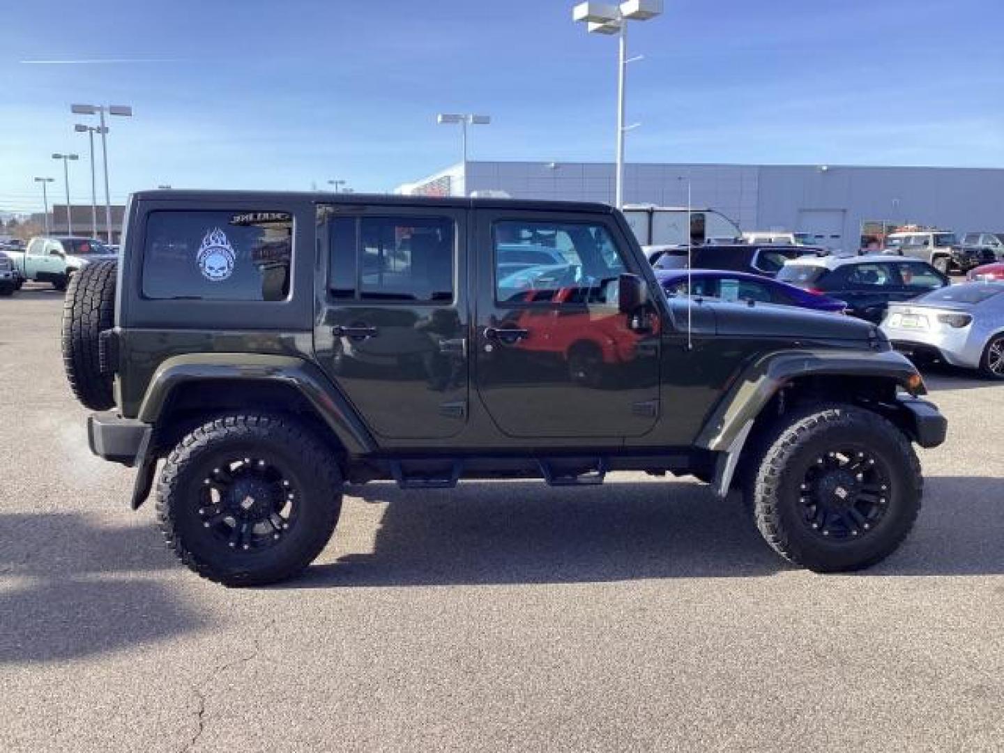 2015 GREEN /Black, cloth Jeep Wrangler Unlimited Sahara 4WD (1C4BJWEG9FL) with an 3.6L V6 DOHC 24V FFV engine, 5-Speed Automatic transmission, located at 1235 N Woodruff Ave., Idaho Falls, 83401, (208) 523-1053, 43.507172, -112.000488 - Photo#5