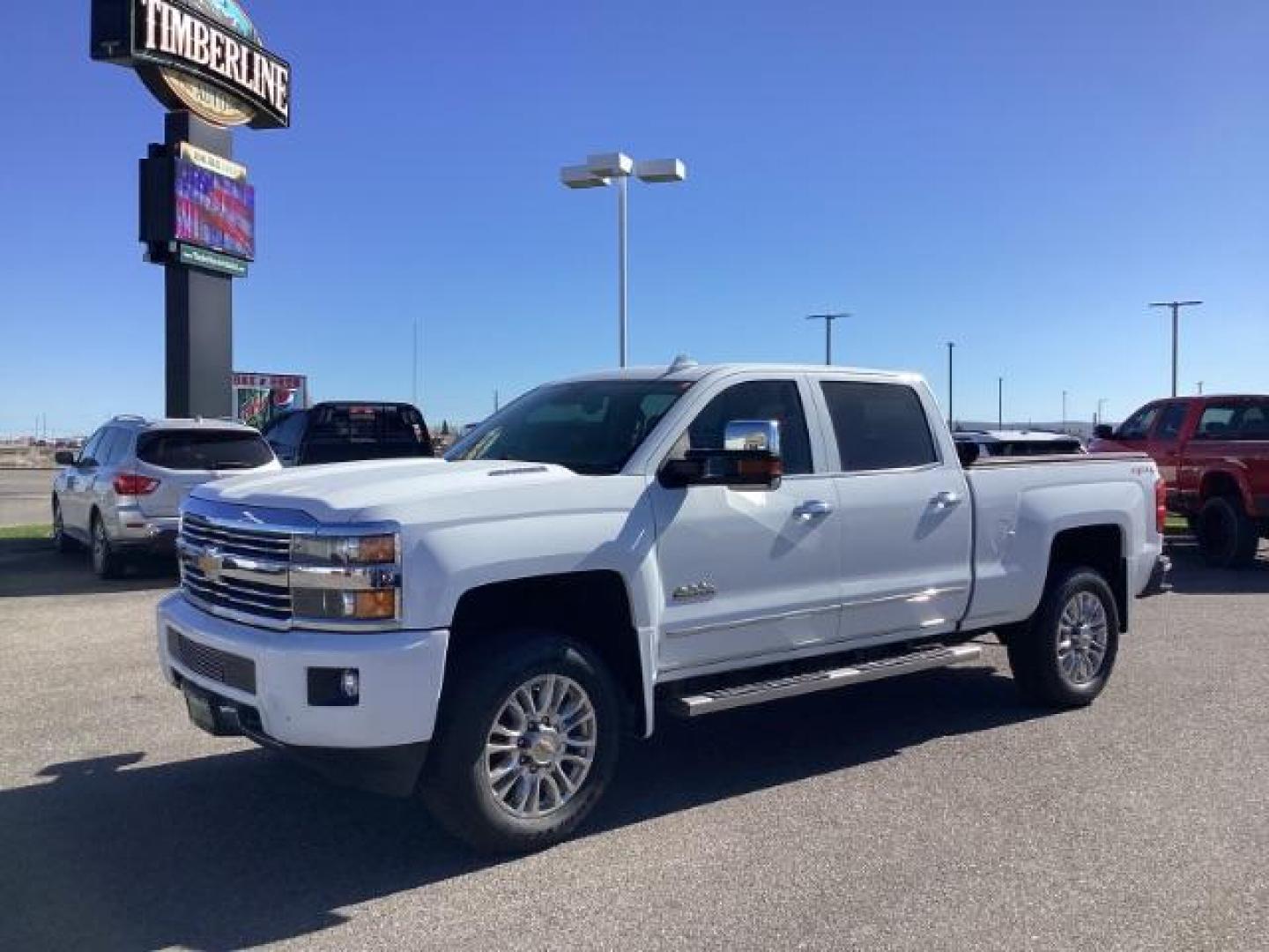 2015 Summit White /Jet Black Chevrolet Silverado 2500HD LT Crew Cab 4WD (1GC1KXE81FF) with an 6.6L V8 OHV 32V TURBO DIESEL engine, 6-Speed Automatic transmission, located at 1235 N Woodruff Ave., Idaho Falls, 83401, (208) 523-1053, 43.507172, -112.000488 - The 2015 Chevrolet Silverado 2500HD High Country Diesel is a top-of-the-line trim level of the Silverado heavy-duty pickup truck, offering a blend of luxury, capability, and advanced technology. Here are some key features you might find on the 2015 Chevrolet Silverado 2500HD High Country Diesel: Dur - Photo#0