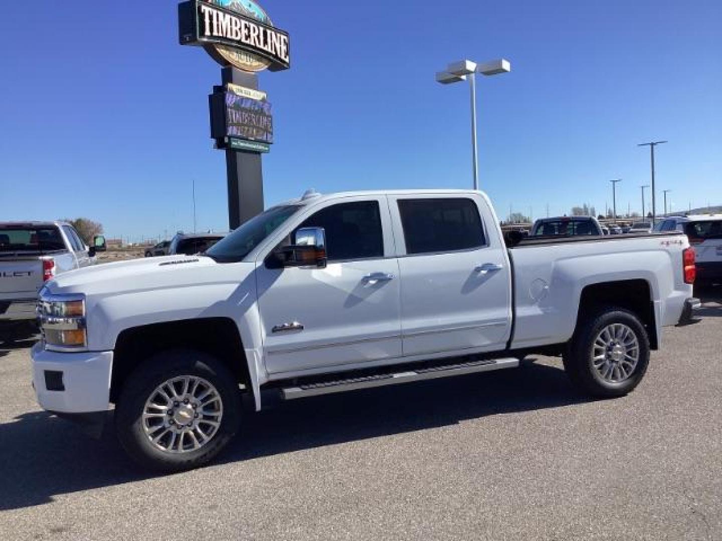 2015 Summit White /Jet Black Chevrolet Silverado 2500HD LT Crew Cab 4WD (1GC1KXE81FF) with an 6.6L V8 OHV 32V TURBO DIESEL engine, 6-Speed Automatic transmission, located at 1235 N Woodruff Ave., Idaho Falls, 83401, (208) 523-1053, 43.507172, -112.000488 - The 2015 Chevrolet Silverado 2500HD High Country Diesel is a top-of-the-line trim level of the Silverado heavy-duty pickup truck, offering a blend of luxury, capability, and advanced technology. Here are some key features you might find on the 2015 Chevrolet Silverado 2500HD High Country Diesel: Dur - Photo#1