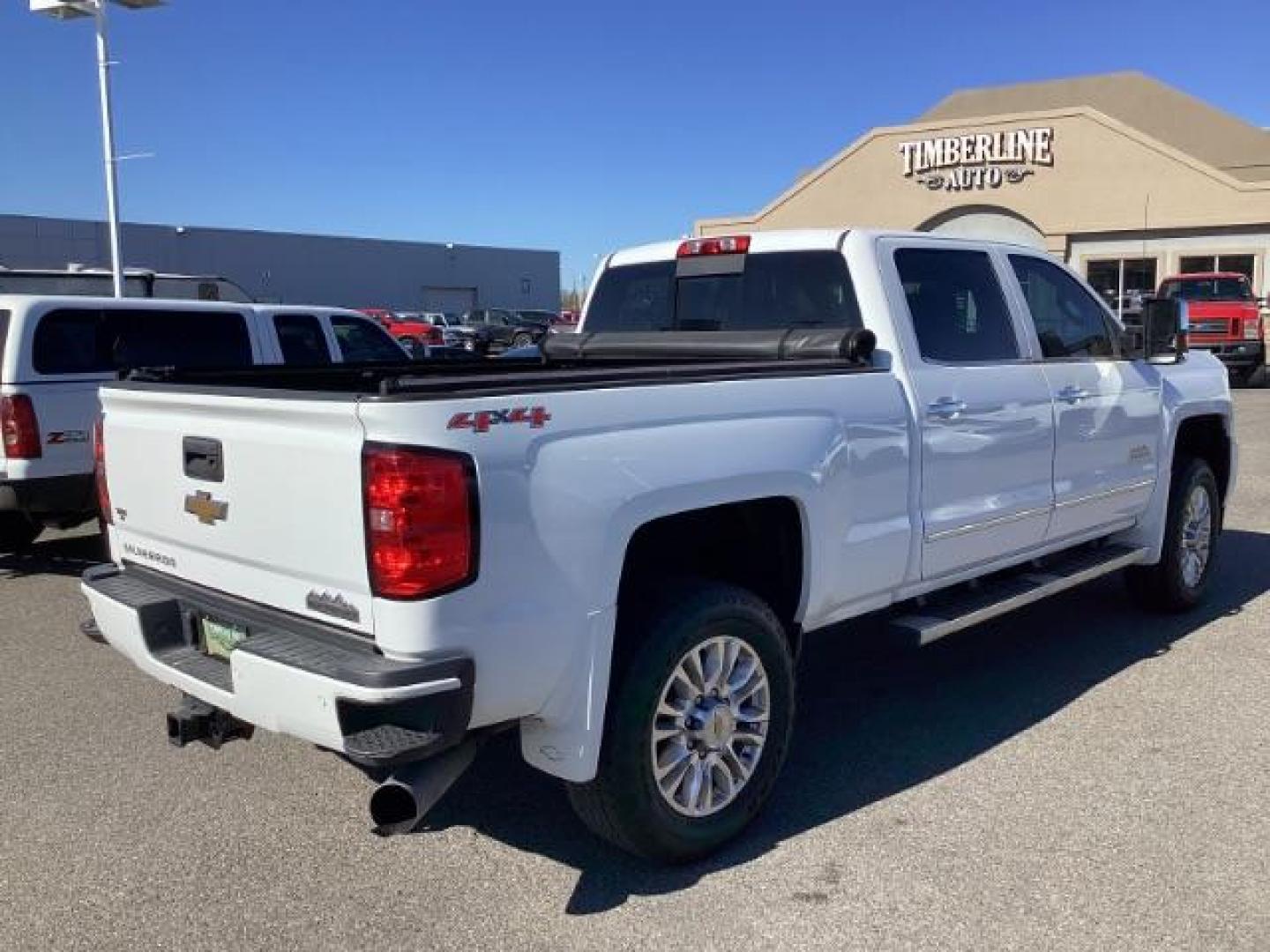 2015 Summit White /Jet Black Chevrolet Silverado 2500HD LT Crew Cab 4WD (1GC1KXE81FF) with an 6.6L V8 OHV 32V TURBO DIESEL engine, 6-Speed Automatic transmission, located at 1235 N Woodruff Ave., Idaho Falls, 83401, (208) 523-1053, 43.507172, -112.000488 - The 2015 Chevrolet Silverado 2500HD High Country Diesel is a top-of-the-line trim level of the Silverado heavy-duty pickup truck, offering a blend of luxury, capability, and advanced technology. Here are some key features you might find on the 2015 Chevrolet Silverado 2500HD High Country Diesel: Dur - Photo#4