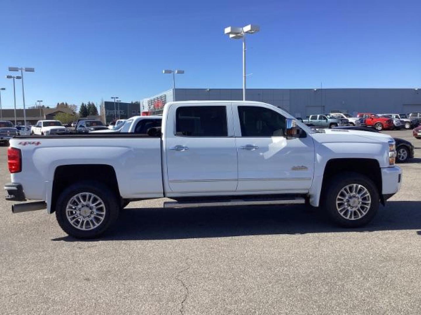 2015 Summit White /Jet Black Chevrolet Silverado 2500HD LT Crew Cab 4WD (1GC1KXE81FF) with an 6.6L V8 OHV 32V TURBO DIESEL engine, 6-Speed Automatic transmission, located at 1235 N Woodruff Ave., Idaho Falls, 83401, (208) 523-1053, 43.507172, -112.000488 - The 2015 Chevrolet Silverado 2500HD High Country Diesel is a top-of-the-line trim level of the Silverado heavy-duty pickup truck, offering a blend of luxury, capability, and advanced technology. Here are some key features you might find on the 2015 Chevrolet Silverado 2500HD High Country Diesel: Dur - Photo#5