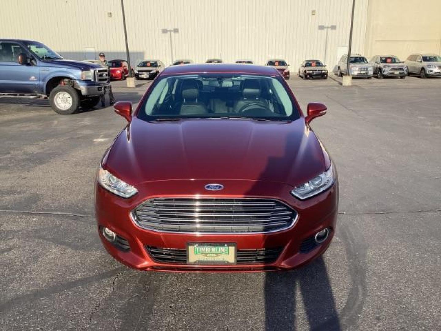 2014 Sunset /Charcoal Black Ford Fusion SE (3FA6P0H95ER) with an 2.0L L4 DOHC 16V engine, 5-Speed Automatic transmission, located at 1235 N Woodruff Ave., Idaho Falls, 83401, (208) 523-1053, 43.507172, -112.000488 - Design: The Fusion features a sleek exterior design that sets it apart from other midsize sedans in its class. With its modern styling, it offers a sophisticated appearance. Performance: The SE trim typically comes with a range of engine options, including fuel-efficient four-cylinder engines and m - Photo#6