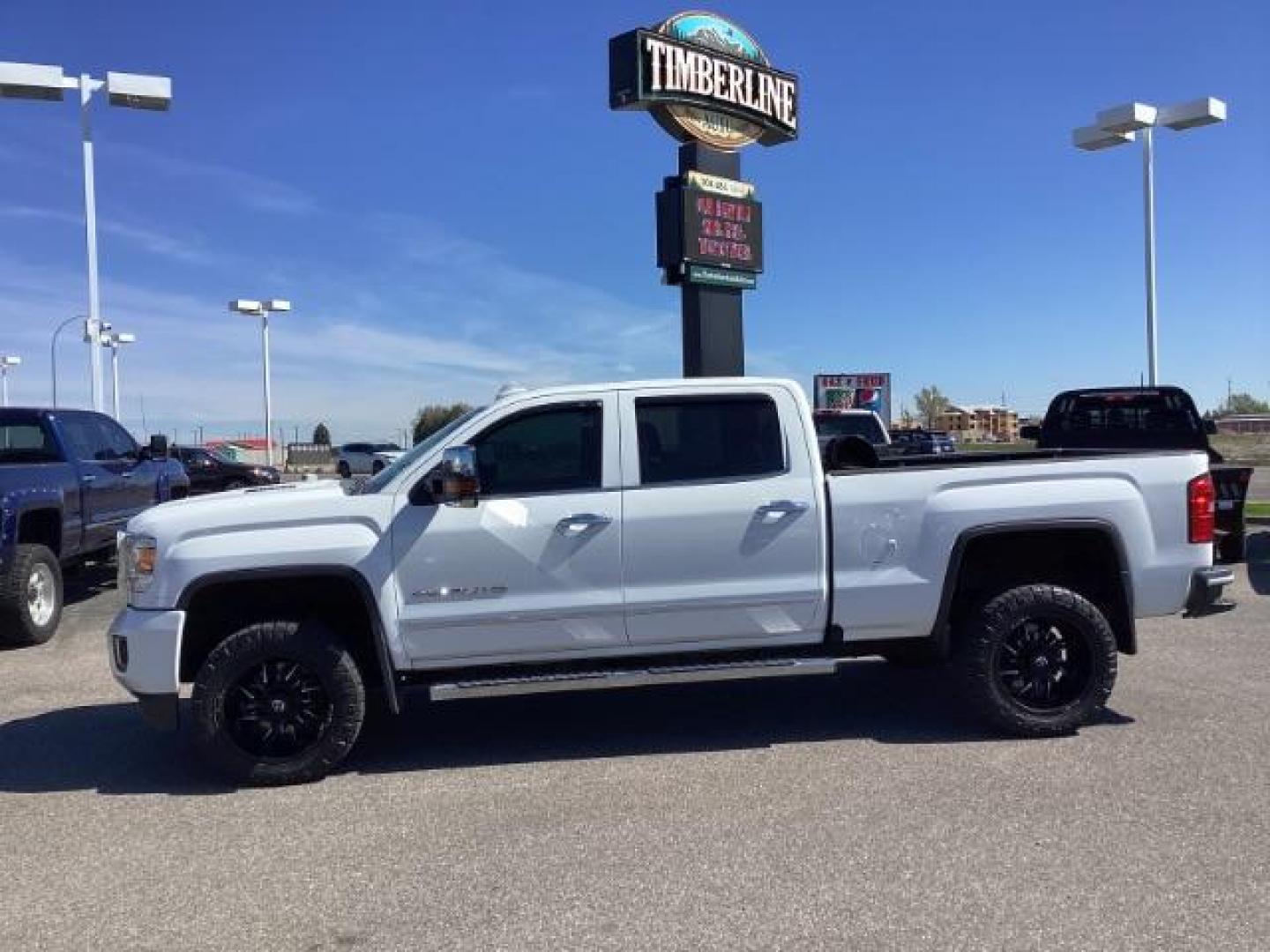 2016 Summit White /Cocoa/Dune, leather GMC Sierra 2500HD Denali Crew Cab 4WD (1GT12UE83GF) with an 6.6L V8 OHV 16 DIESEL engine, 6-Speed Automatic transmission, located at 1235 N Woodruff Ave., Idaho Falls, 83401, (208) 523-1053, 43.507172, -112.000488 - The 2016 GMC Sierra Denali 6.6L typically offers a combination of power, luxury, and capability. Here are some of the key features you can expect to find in this model: Engine: The 6.6-liter V8 turbo diesel engine is one of the standout features of the Sierra Denali. This engine delivers robust per - Photo#1