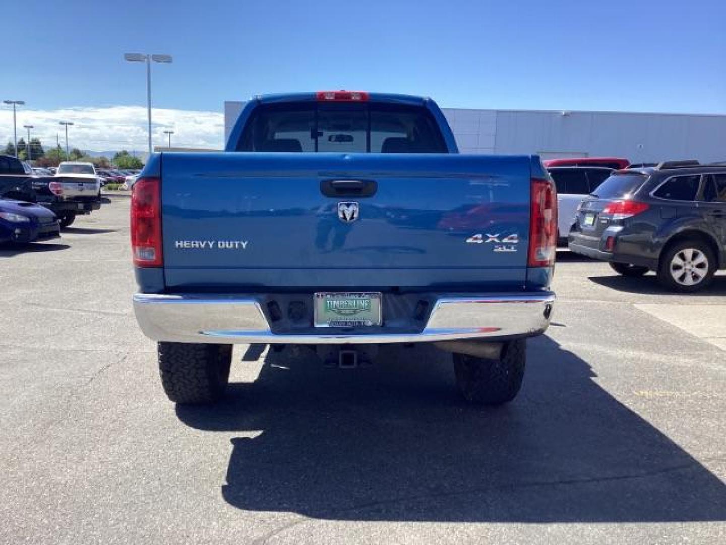 2006 Atlantic Blue Pearlcoat /Medium Slate Gray Cloth Interior Dodge Ram 2500 SLT Quad Cab 4WD (3D7KS28C36G) with an 5.9L L6 OHV 24V TURBO DIESEL engine, 6-Speed Manual transmission, located at 1235 N Woodruff Ave., Idaho Falls, 83401, (208) 523-1053, 43.507172, -112.000488 - Photo#4