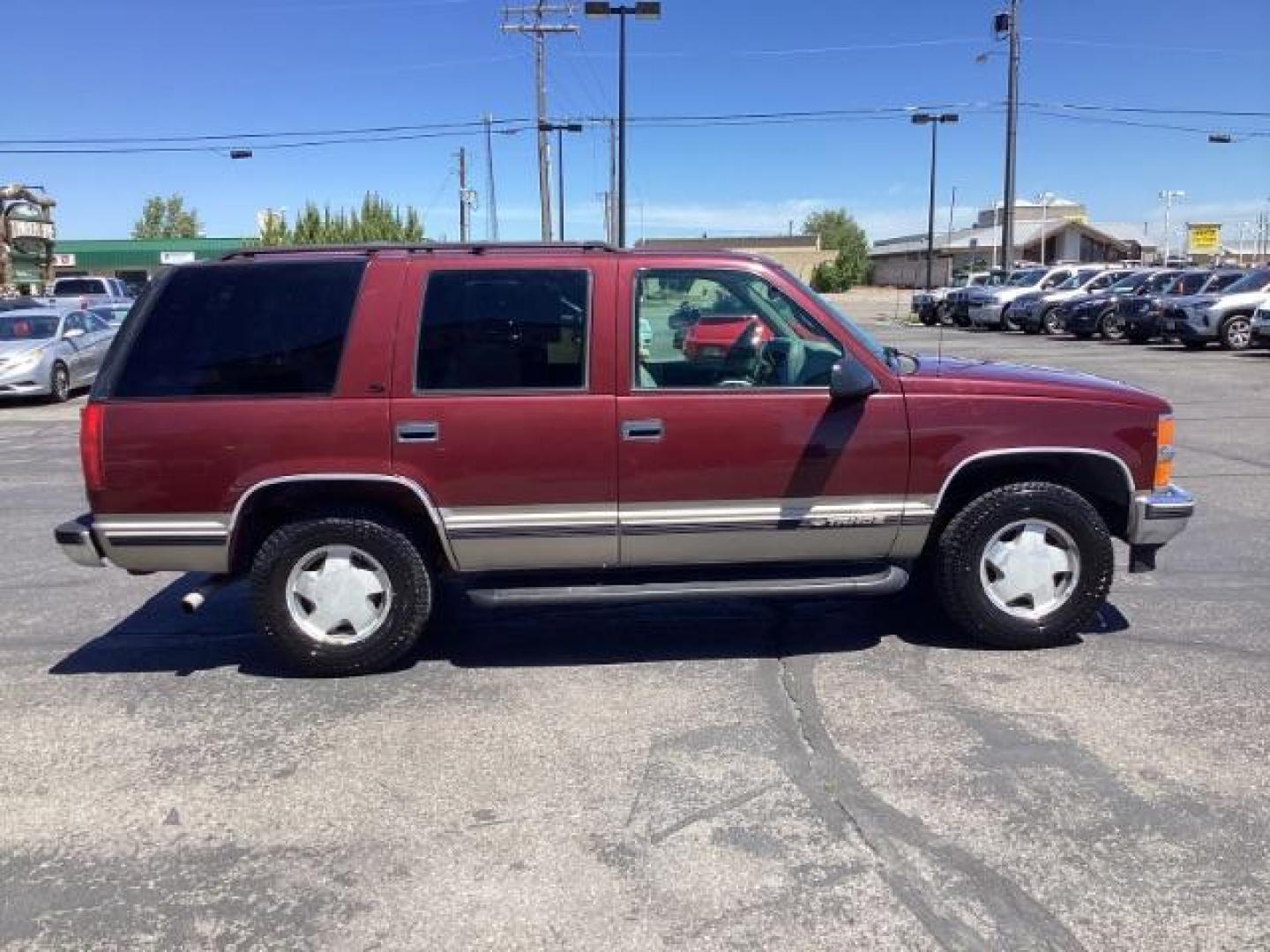 1999 Victory Red Chevrolet Tahoe 4-Door 4WD (1GNEK13R6XJ) with an 5.7L V8 OHV 16V engine, 4-Speed Automatic transmission, located at 1235 N Woodruff Ave., Idaho Falls, 83401, (208) 523-1053, 43.507172, -112.000488 - Photo#3