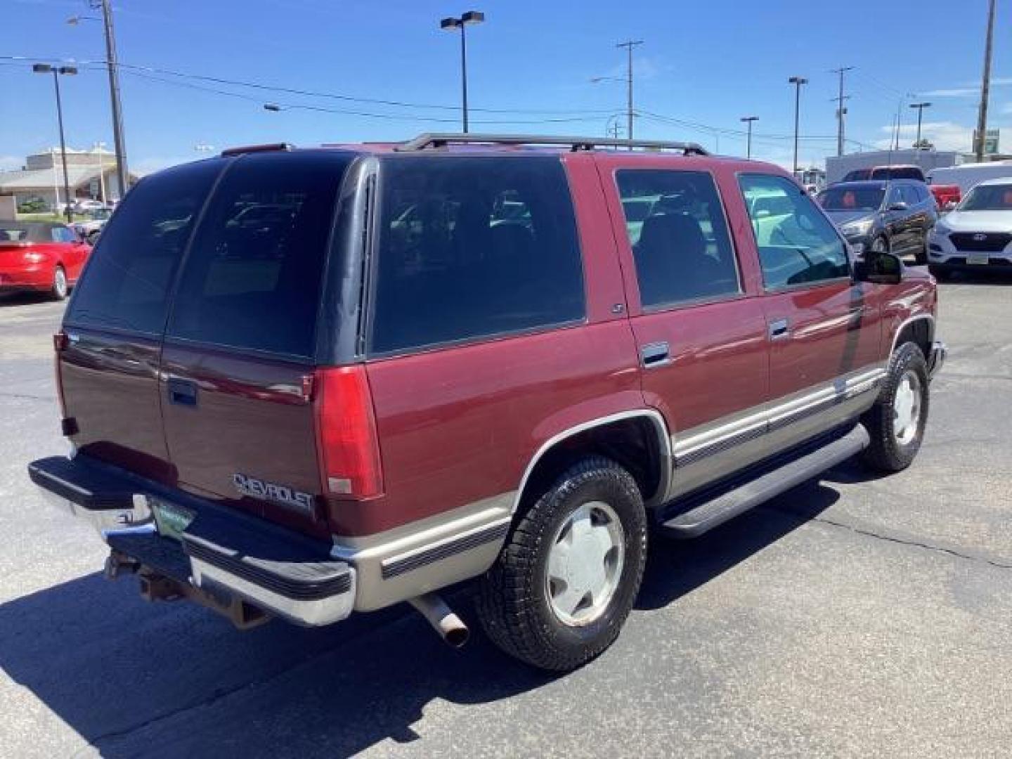 1999 Victory Red Chevrolet Tahoe 4-Door 4WD (1GNEK13R6XJ) with an 5.7L V8 OHV 16V engine, 4-Speed Automatic transmission, located at 1235 N Woodruff Ave., Idaho Falls, 83401, (208) 523-1053, 43.507172, -112.000488 - Photo#4