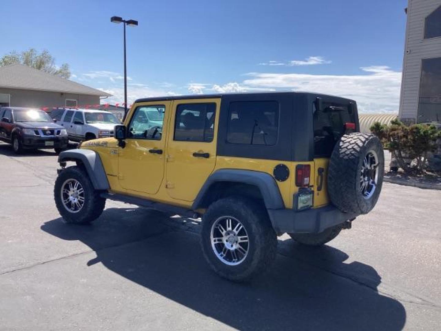 2008 YELLOW Jeep Wrangler Unlimited X 4WD (1J4GA39198L) with an 3.8L V6 OHV 12V engine, located at 1235 N Woodruff Ave., Idaho Falls, 83401, (208) 523-1053, 43.507172, -112.000488 - Photo#2