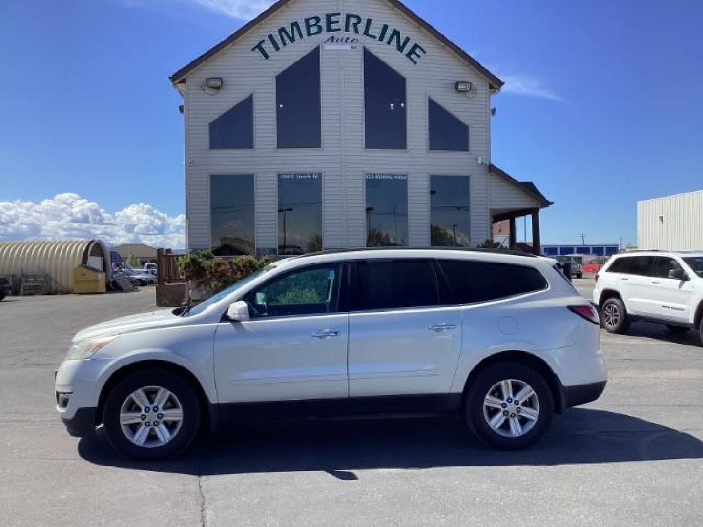 2014 White Diamond Tricoat /Ebony Chevrolet Traverse 2LT AWD (1GNKVHKD1EJ) with an 3.6L V6 DOHC 24V engine, 6-Speed Automatic transmission, located at 1235 N Woodruff Ave., Idaho Falls, 83401, (208) 523-1053, 43.507172, -112.000488 - The 2014 Chevrolet Traverse 2LT AWD is a midsize SUV known for its spacious interior, comfortable ride, and ample cargo space. Here are some of its key features: Engine: It typically comes with a 3.6-liter V6 engine that produces around 281 horsepower, paired with a 6-speed automatic transmission. - Photo#1