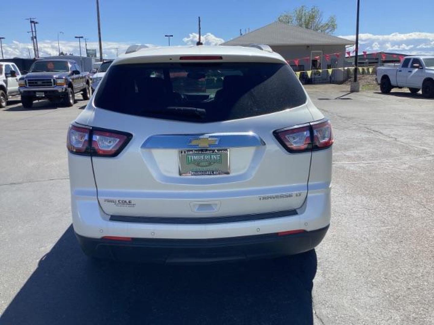 2014 White Diamond Tricoat /Ebony Chevrolet Traverse 2LT AWD (1GNKVHKD1EJ) with an 3.6L V6 DOHC 24V engine, 6-Speed Automatic transmission, located at 1235 N Woodruff Ave., Idaho Falls, 83401, (208) 523-1053, 43.507172, -112.000488 - The 2014 Chevrolet Traverse 2LT AWD is a midsize SUV known for its spacious interior, comfortable ride, and ample cargo space. Here are some of its key features: Engine: It typically comes with a 3.6-liter V6 engine that produces around 281 horsepower, paired with a 6-speed automatic transmission. - Photo#3