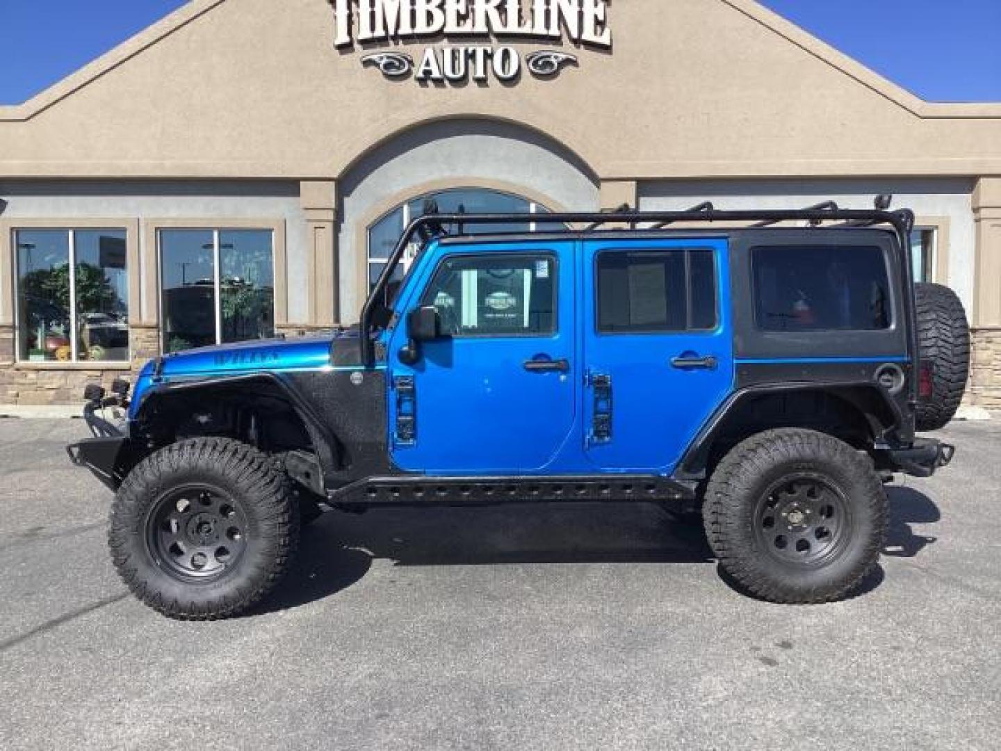 2016 Hydro Blue Pearl Coat /Black, cloth Jeep Wrangler Unlimited Sport 4WD (1C4BJWDG6GL) with an 3.6L V6 DOHC 24V FFV engine, 6-Speed Manual transmission, located at 1235 N Woodruff Ave., Idaho Falls, 83401, (208) 523-1053, 43.507172, -112.000488 - Photo#2