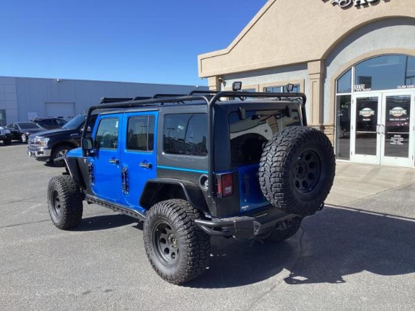 2016 Hydro Blue Pearl Coat /Black, cloth Jeep Wrangler Unlimited Sport 4WD (1C4BJWDG6GL) with an 3.6L V6 DOHC 24V FFV engine, 6-Speed Manual transmission, located at 1235 N Woodruff Ave., Idaho Falls, 83401, (208) 523-1053, 43.507172, -112.000488 - Photo#3