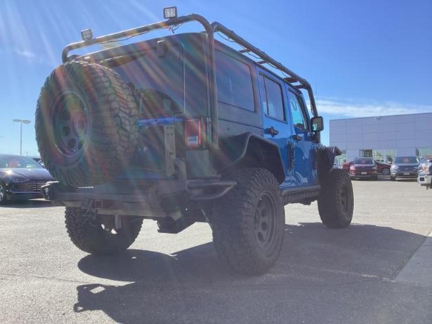 2016 Hydro Blue Pearl Coat /Black, cloth Jeep Wrangler Unlimited Sport 4WD (1C4BJWDG6GL) with an 3.6L V6 DOHC 24V FFV engine, 6-Speed Manual transmission, located at 1235 N Woodruff Ave., Idaho Falls, 83401, (208) 523-1053, 43.507172, -112.000488 - Photo#5