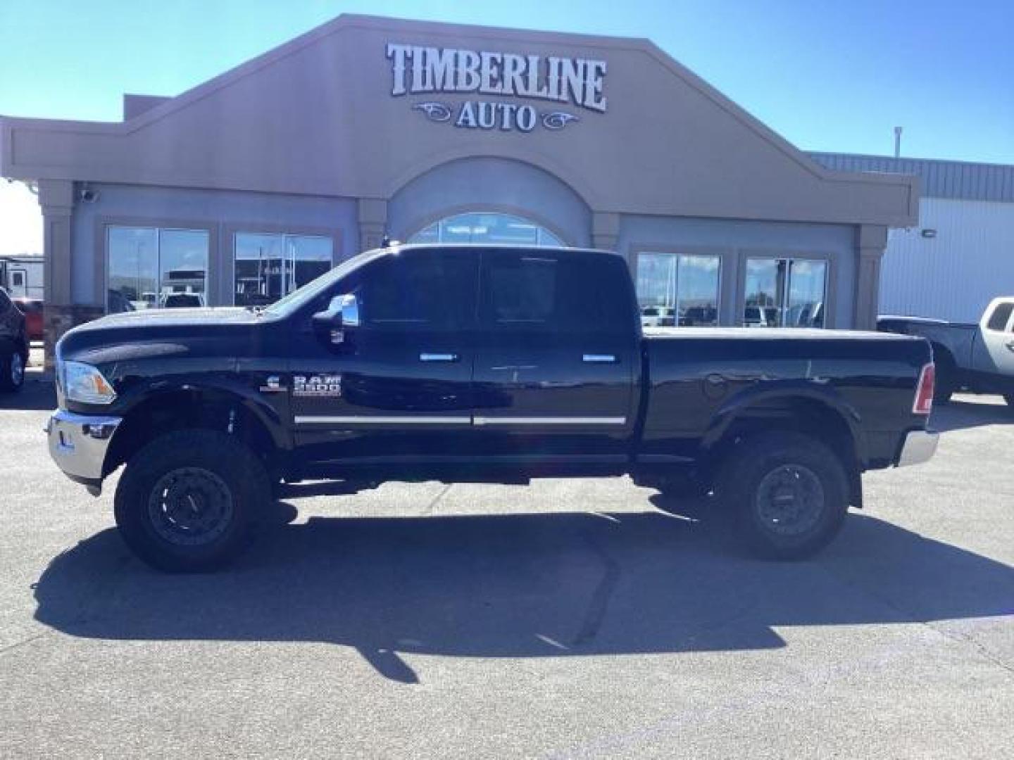 2014 Black Clearcoat /Black RAM 2500 Laramie Crew Cab SWB 4WD (3C6UR5FLXEG) with an 6.7L L6 OHV 24V TURBO DIESEL engine, 6-Speed Automatic transmission, located at 1235 N Woodruff Ave., Idaho Falls, 83401, (208) 523-1053, 43.507172, -112.000488 - Photo#1