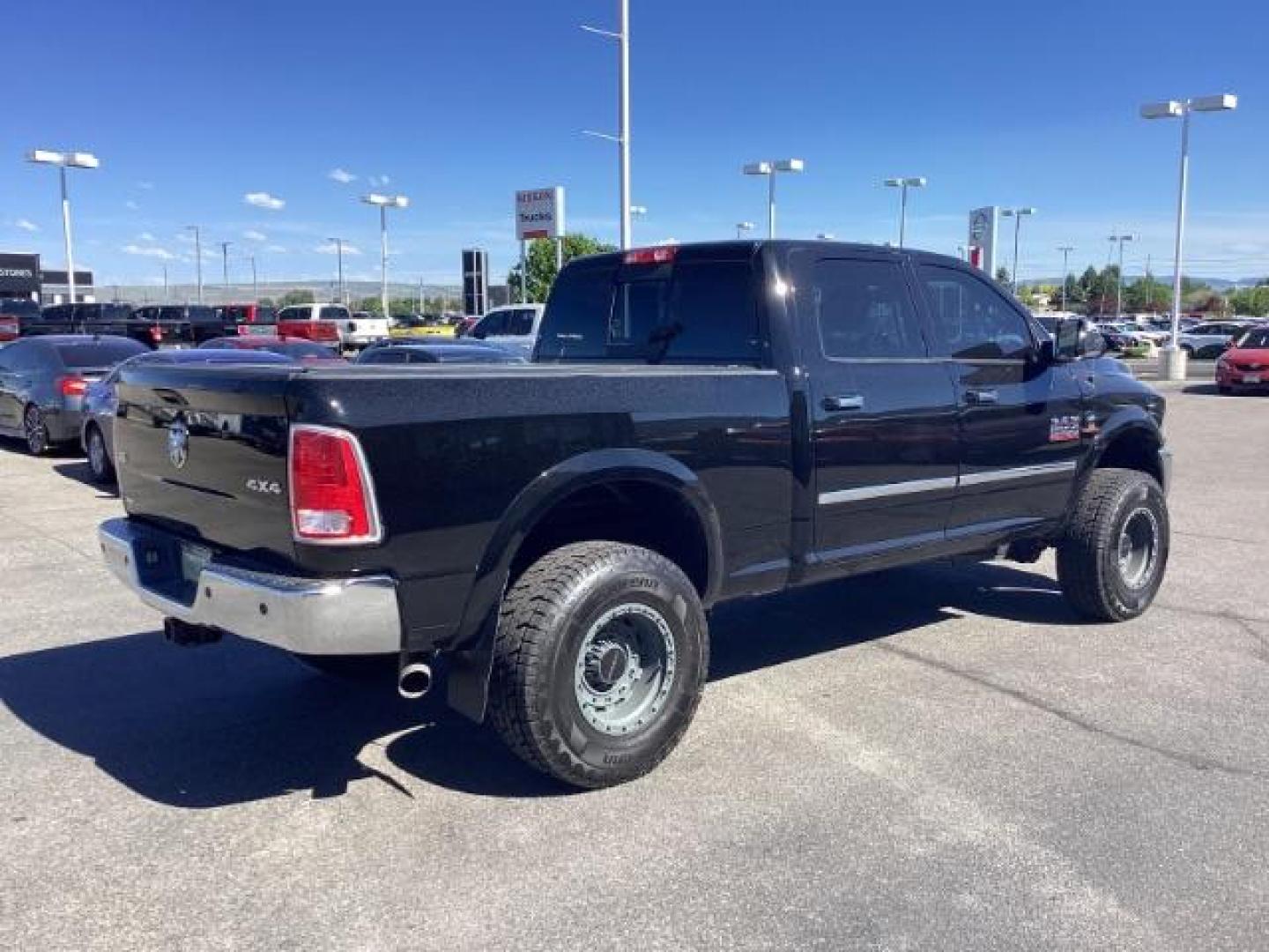 2014 Black Clearcoat /Black RAM 2500 Laramie Crew Cab SWB 4WD (3C6UR5FLXEG) with an 6.7L L6 OHV 24V TURBO DIESEL engine, 6-Speed Automatic transmission, located at 1235 N Woodruff Ave., Idaho Falls, 83401, (208) 523-1053, 43.507172, -112.000488 - Photo#4