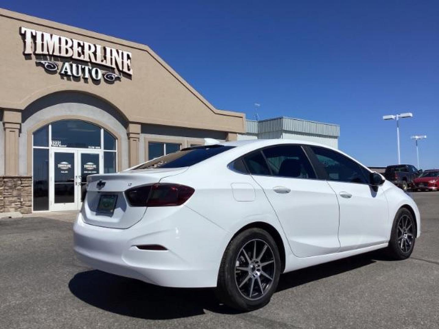 2017 Summit White /Jet Black, cloth Chevrolet Cruze LT Auto (1G1BE5SM0H7) with an 1.4L L4 DOHC 16V TURBO engine, 6-Speed Automatic transmission, located at 1235 N Woodruff Ave., Idaho Falls, 83401, (208) 523-1053, 43.507172, -112.000488 - Photo#4