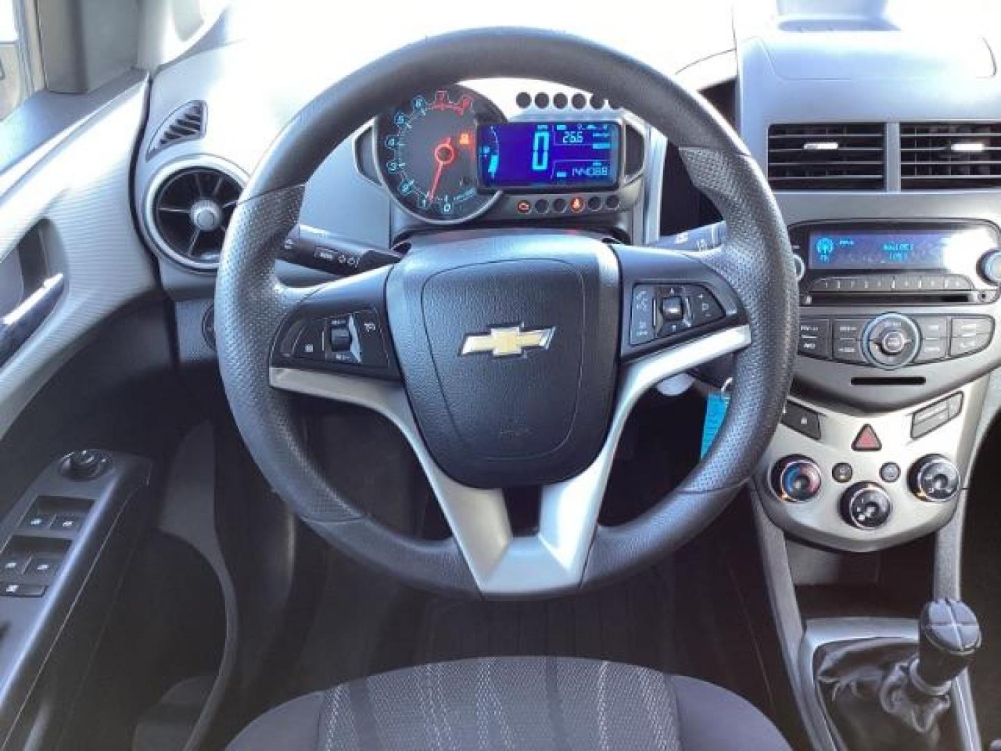 2012 Inferno Orange Metallic /Jet Blk/ Dark Titanium Cloth Interior Chevrolet Sonic 1LT 5-Door (1G1JD6SB5C4) with an 1.4L L4 DOHC 24V TURBO engine, 5-Speed Manual transmission, located at 1235 N Woodruff Ave., Idaho Falls, 83401, (208) 523-1053, 43.507172, -112.000488 - Photo#14