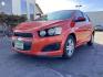 2012 Inferno Orange Metallic /Jet Blk/ Dark Titanium Cloth Interior Chevrolet Sonic 1LT 5-Door (1G1JD6SB5C4) with an 1.4L L4 DOHC 24V TURBO engine, 5-Speed Manual transmission, located at 1235 N Woodruff Ave., Idaho Falls, 83401, (208) 523-1053, 43.507172, -112.000488 - Photo#1