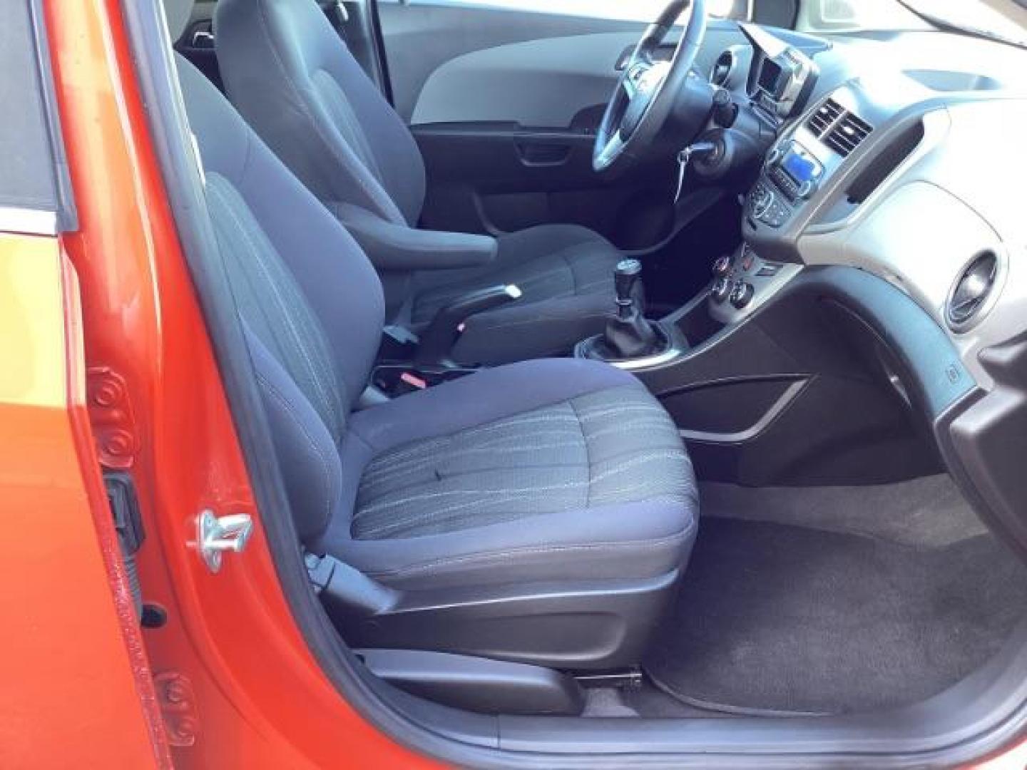 2012 Inferno Orange Metallic /Jet Blk/ Dark Titanium Cloth Interior Chevrolet Sonic 1LT 5-Door (1G1JD6SB5C4) with an 1.4L L4 DOHC 24V TURBO engine, 5-Speed Manual transmission, located at 1235 N Woodruff Ave., Idaho Falls, 83401, (208) 523-1053, 43.507172, -112.000488 - Photo#22