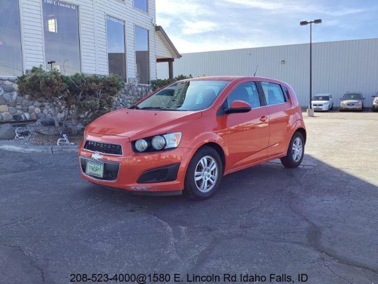 2012 Inferno Orange Metallic /Jet Blk/ Dark Titanium Cloth Interior Chevrolet Sonic 1LT 5-Door (1G1JD6SB5C4) with an 1.4L L4 DOHC 24V TURBO engine, 5-Speed Manual transmission, located at 1235 N Woodruff Ave., Idaho Falls, 83401, (208) 523-1053, 43.507172, -112.000488 - Get ready to enjoy a spirited drive with this 2012 Chevrolet Sonic Hatchback 1LT! Equipped with a peppy 1.4L turbocharged engine, this compact hatchback delivers impressive fuel efficiency without sacrificing performance. Perfect for urban commuting or weekend getaways, the Sonic combines style and - Photo#0