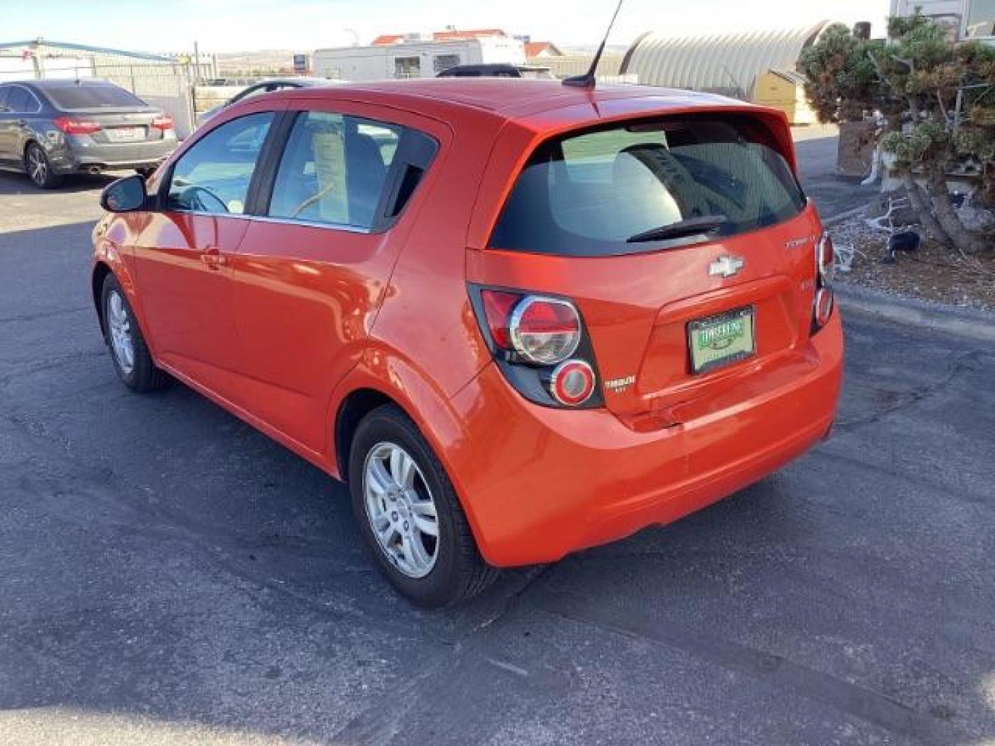 2012 Inferno Orange Metallic /Jet Blk/ Dark Titanium Cloth Interior Chevrolet Sonic 1LT 5-Door (1G1JD6SB5C4) with an 1.4L L4 DOHC 24V TURBO engine, 5-Speed Manual transmission, located at 1235 N Woodruff Ave., Idaho Falls, 83401, (208) 523-1053, 43.507172, -112.000488 - Photo#3