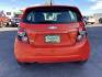 2012 Inferno Orange Metallic /Jet Blk/ Dark Titanium Cloth Interior Chevrolet Sonic 1LT 5-Door (1G1JD6SB5C4) with an 1.4L L4 DOHC 24V TURBO engine, 5-Speed Manual transmission, located at 1235 N Woodruff Ave., Idaho Falls, 83401, (208) 523-1053, 43.507172, -112.000488 - Photo#4