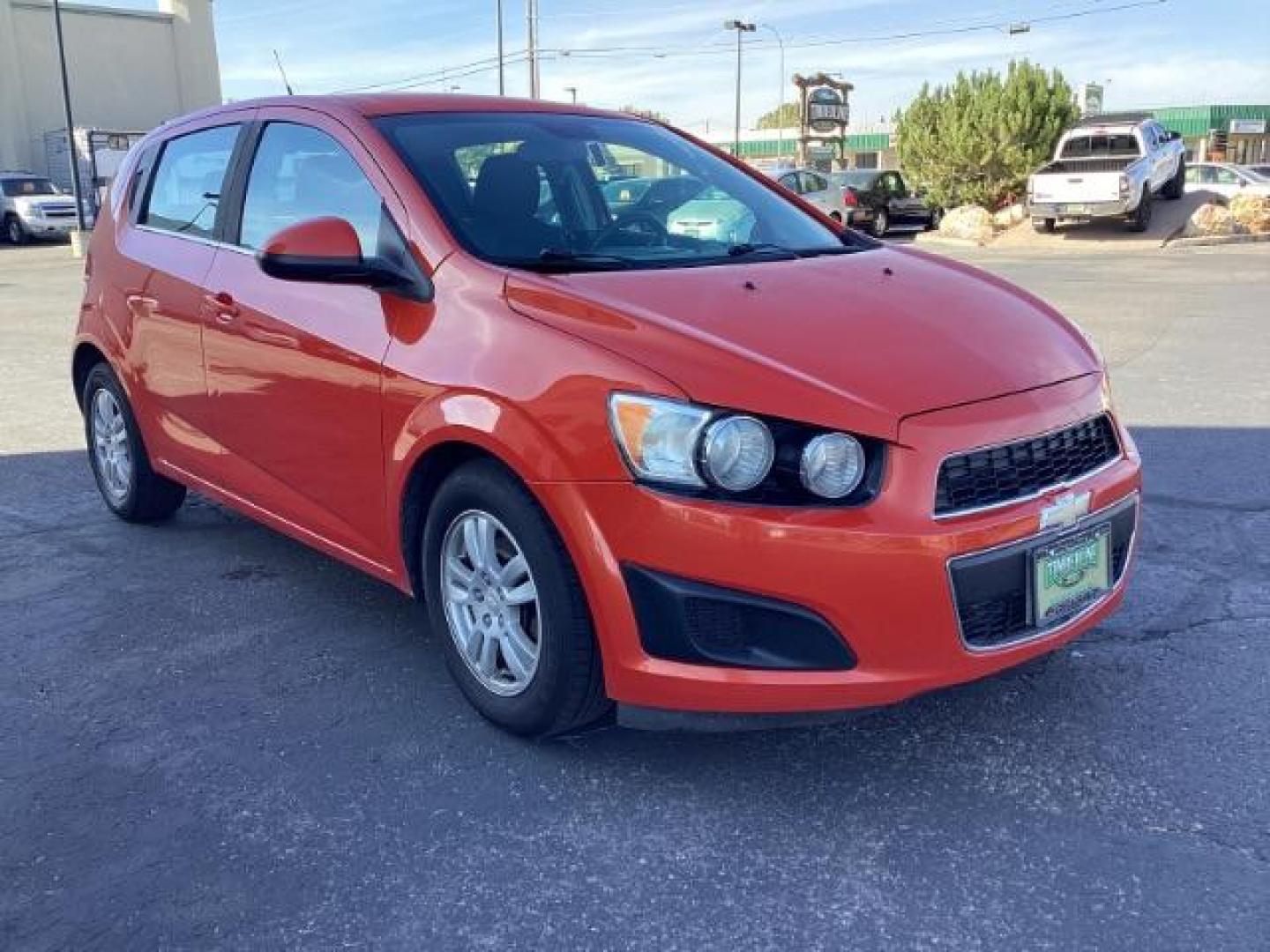 2012 Inferno Orange Metallic /Jet Blk/ Dark Titanium Cloth Interior Chevrolet Sonic 1LT 5-Door (1G1JD6SB5C4) with an 1.4L L4 DOHC 24V TURBO engine, 5-Speed Manual transmission, located at 1235 N Woodruff Ave., Idaho Falls, 83401, (208) 523-1053, 43.507172, -112.000488 - Photo#7