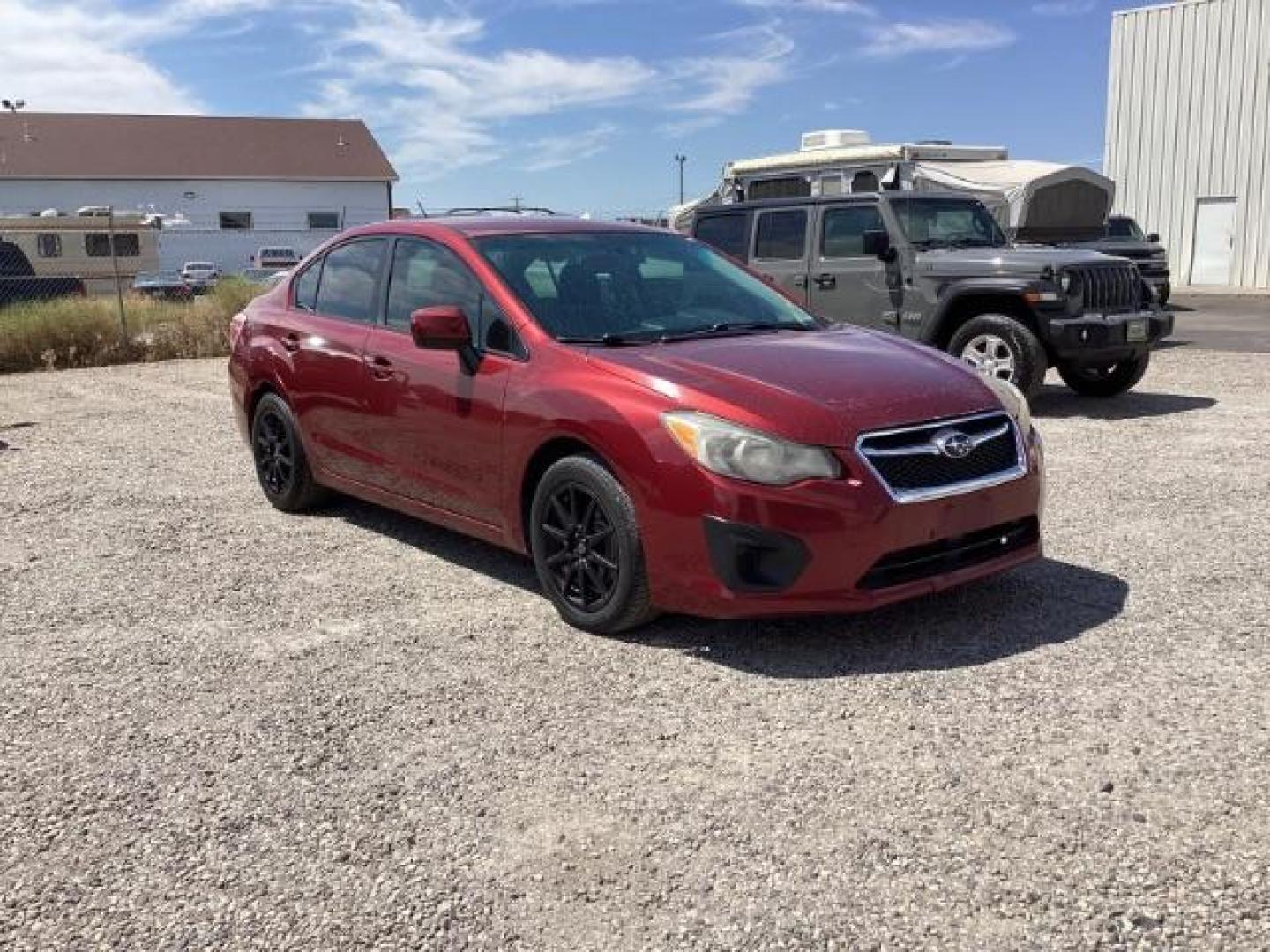 2013 Venetian Red Pearl /Black Cloth Interior Subaru Impreza 2.0i Premium 4-Door w/All Weather Package (JF1GJAC61DH) with an 2.0L H4 DOHC 16V engine, Continuously Variable Transmission transmission, located at 1235 N Woodruff Ave., Idaho Falls, 83401, (208) 523-1053, 43.507172, -112.000488 - Photo#0