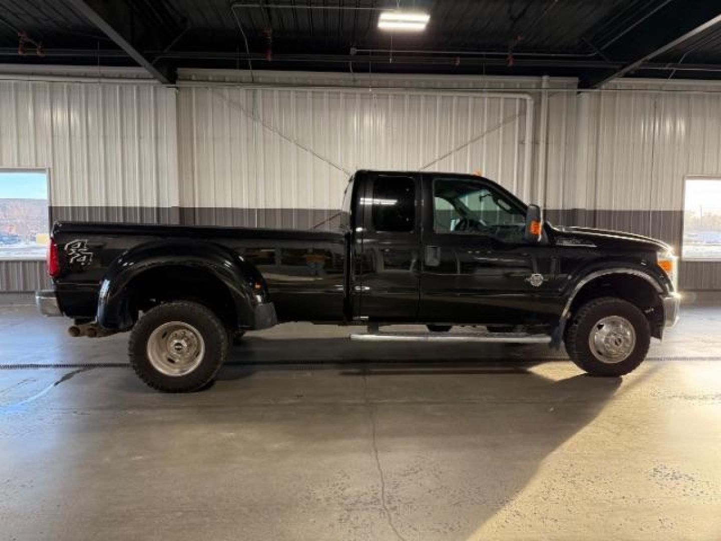 2015 Tuxedo Black Metallic /Steel Ford F-350 SD XLT SuperCab Long Bed DRW 4WD (1FT8X3DT1FE) with an 6.7L V8 OHV 16V DIESEL engine, 6-Speed Automatic transmission, located at 1235 N Woodruff Ave., Idaho Falls, 83401, (208) 523-1053, 43.507172, -112.000488 - Photo#1