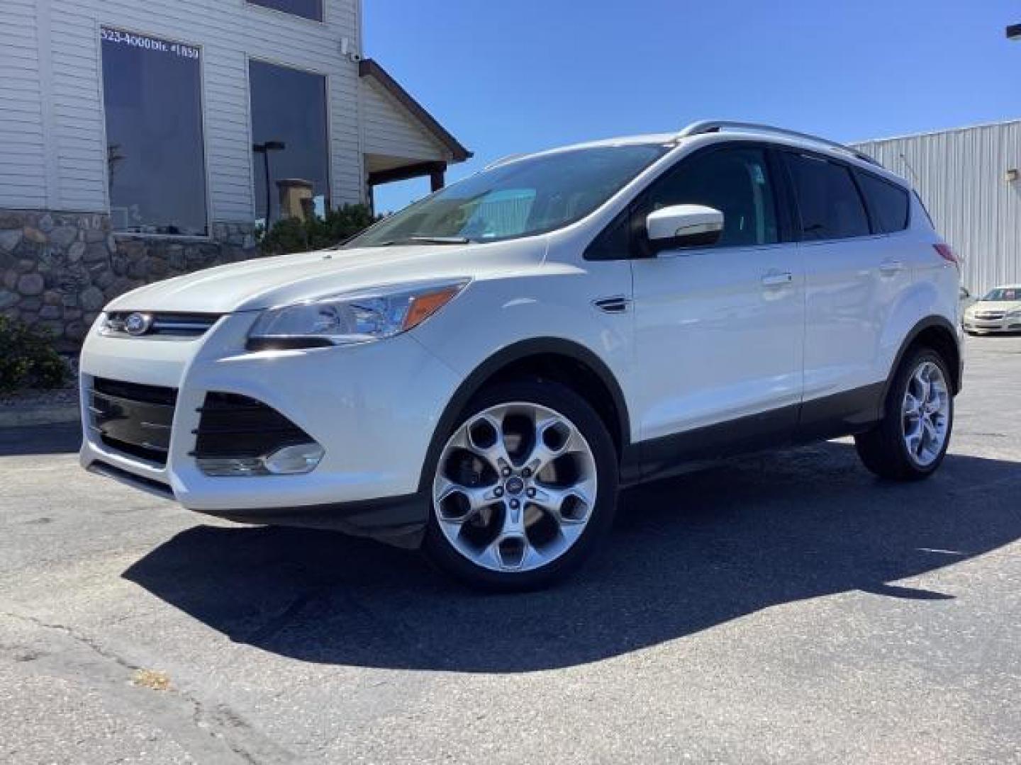 2014 Ingot Silver Metallic Ford Escape Titanium FWD (1FMCU0J95EU) with an 2.0L L4 DOHC 16V engine, 6-Speed Automatic transmission, located at 1235 N Woodruff Ave., Idaho Falls, 83401, (208) 523-1053, 43.507172, -112.000488 - Photo#1