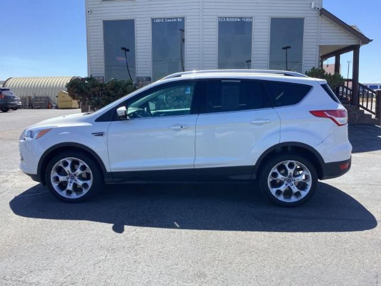 2014 Ingot Silver Metallic Ford Escape Titanium FWD (1FMCU0J95EU) with an 2.0L L4 DOHC 16V engine, 6-Speed Automatic transmission, located at 1235 N Woodruff Ave., Idaho Falls, 83401, (208) 523-1053, 43.507172, -112.000488 - Photo#2