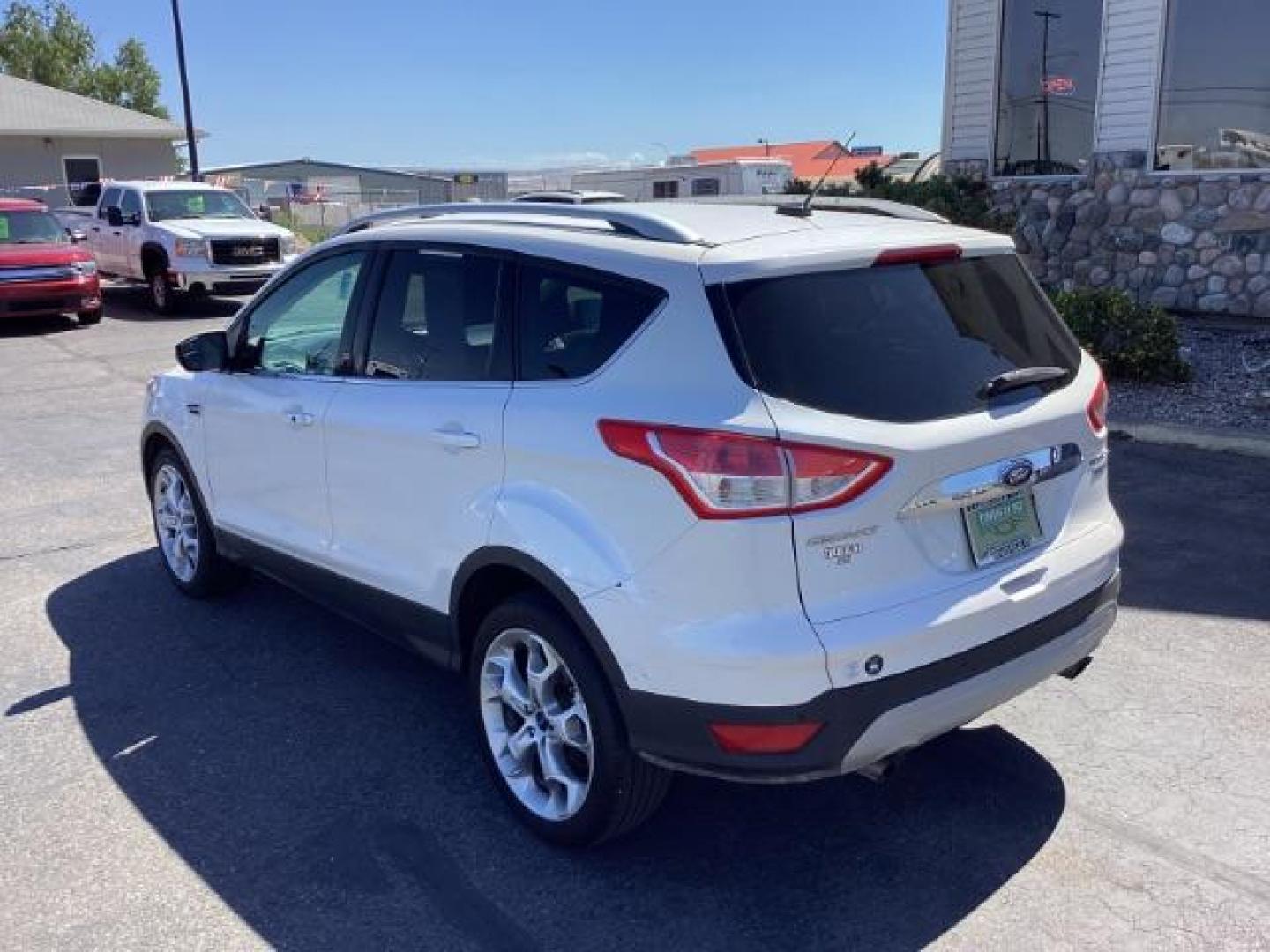 2014 Ingot Silver Metallic Ford Escape Titanium FWD (1FMCU0J95EU) with an 2.0L L4 DOHC 16V engine, 6-Speed Automatic transmission, located at 1235 N Woodruff Ave., Idaho Falls, 83401, (208) 523-1053, 43.507172, -112.000488 - Photo#3