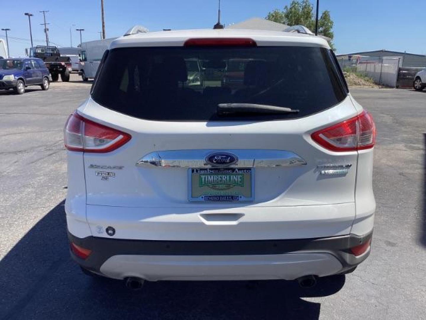 2014 Ingot Silver Metallic Ford Escape Titanium FWD (1FMCU0J95EU) with an 2.0L L4 DOHC 16V engine, 6-Speed Automatic transmission, located at 1235 N Woodruff Ave., Idaho Falls, 83401, (208) 523-1053, 43.507172, -112.000488 - Photo#4