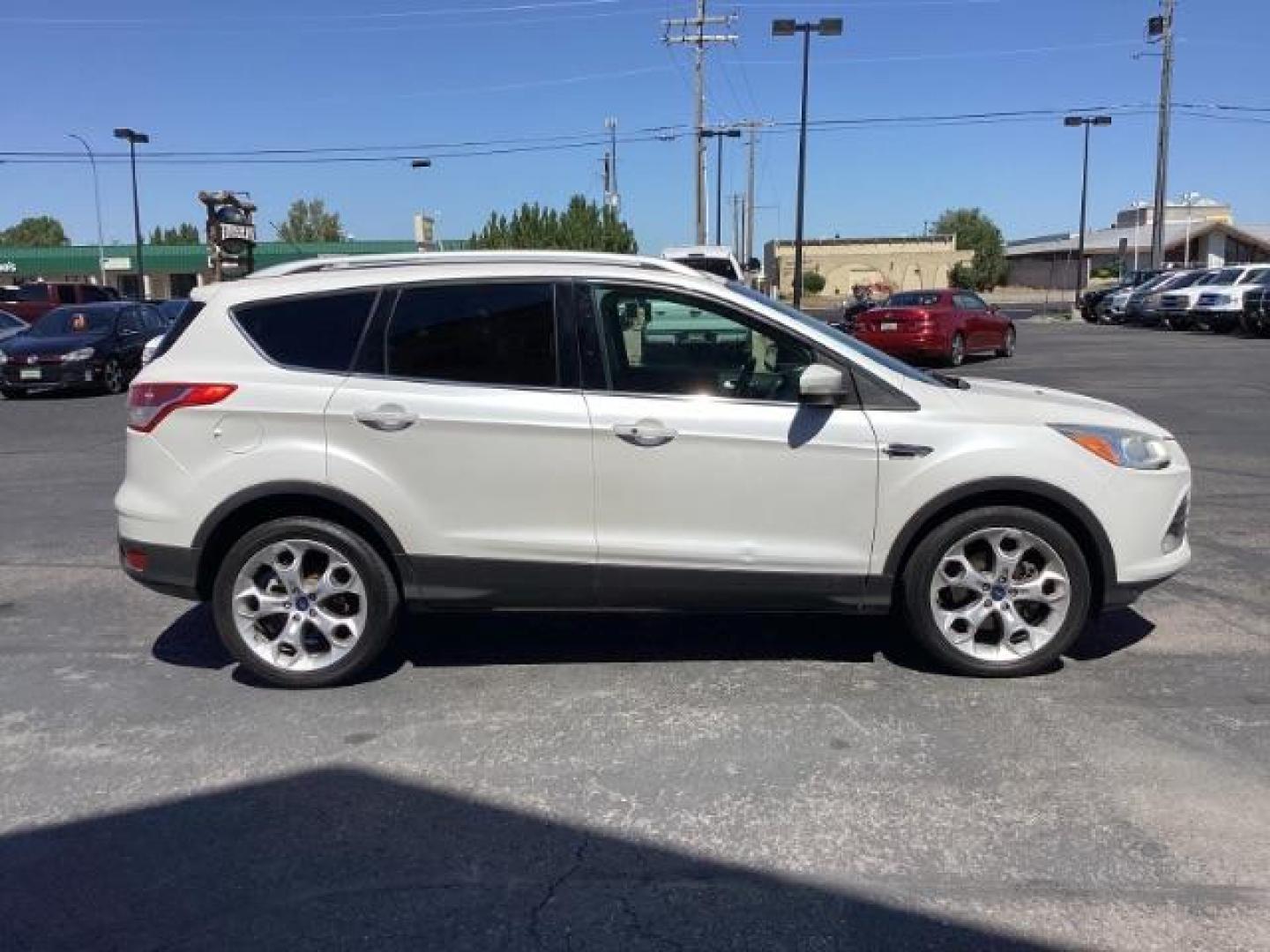 2014 Ingot Silver Metallic Ford Escape Titanium FWD (1FMCU0J95EU) with an 2.0L L4 DOHC 16V engine, 6-Speed Automatic transmission, located at 1235 N Woodruff Ave., Idaho Falls, 83401, (208) 523-1053, 43.507172, -112.000488 - Photo#6