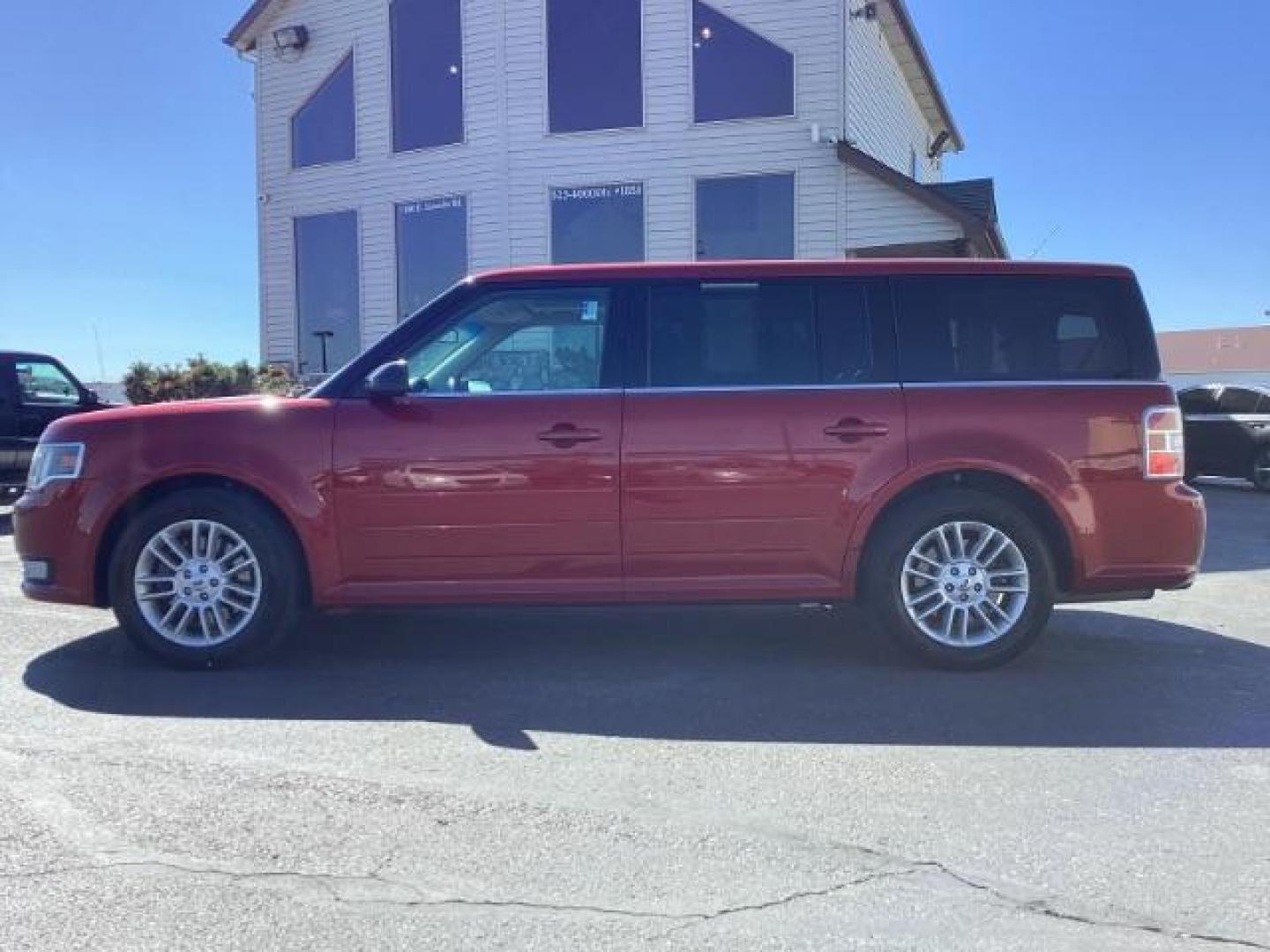 2014 Ruby Red Met Tinted CC Ford Flex SEL AWD (2FMHK6C82EB) with an 3.5L V6 DOHC 24V engine, 6-Speed Automatic Overdrive transmission, located at 1235 N Woodruff Ave., Idaho Falls, 83401, (208) 523-1053, 43.507172, -112.000488 - Photo#2