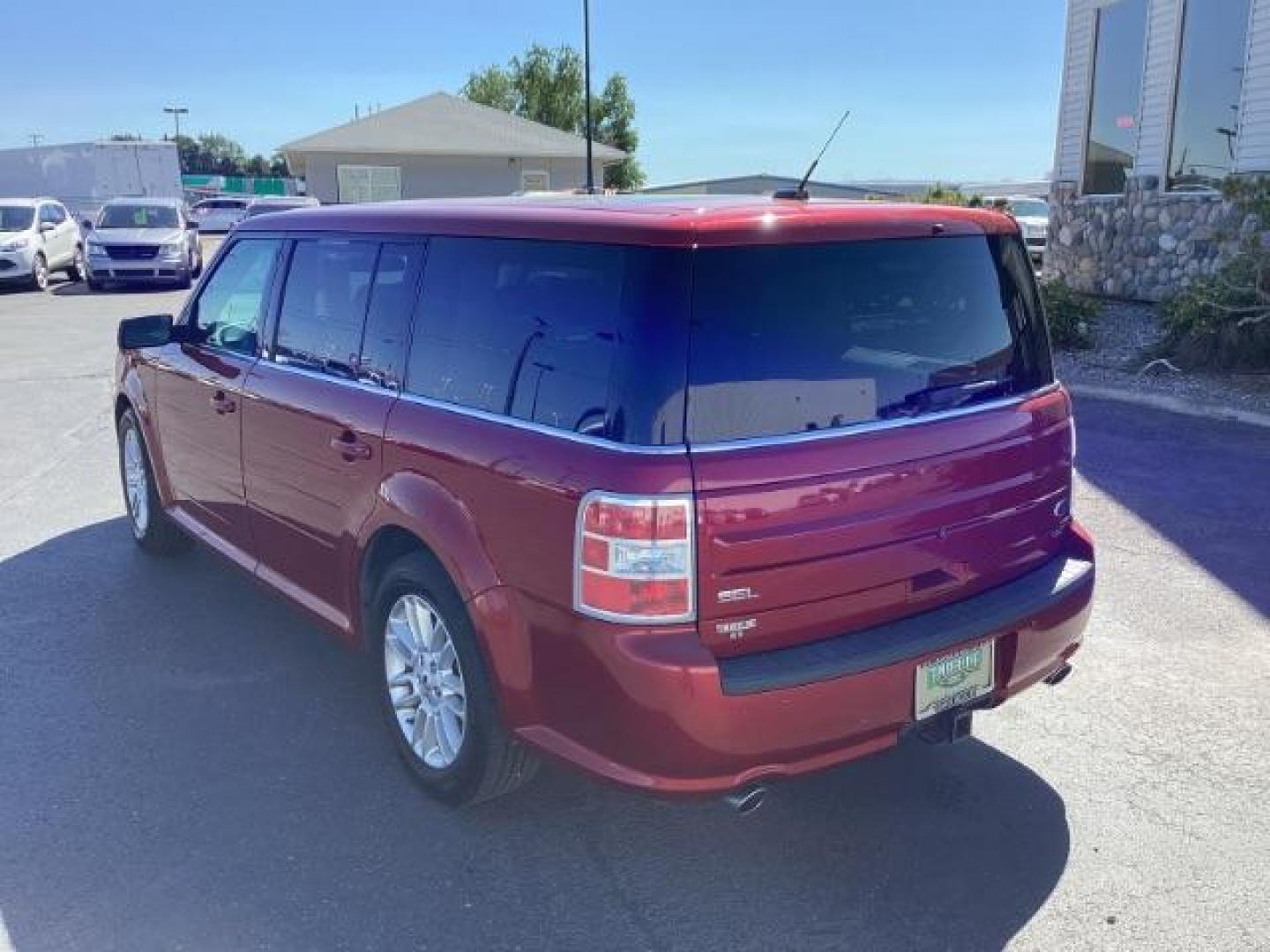 2014 Ruby Red Met Tinted CC Ford Flex SEL AWD (2FMHK6C82EB) with an 3.5L V6 DOHC 24V engine, 6-Speed Automatic Overdrive transmission, located at 1235 N Woodruff Ave., Idaho Falls, 83401, (208) 523-1053, 43.507172, -112.000488 - Photo#3