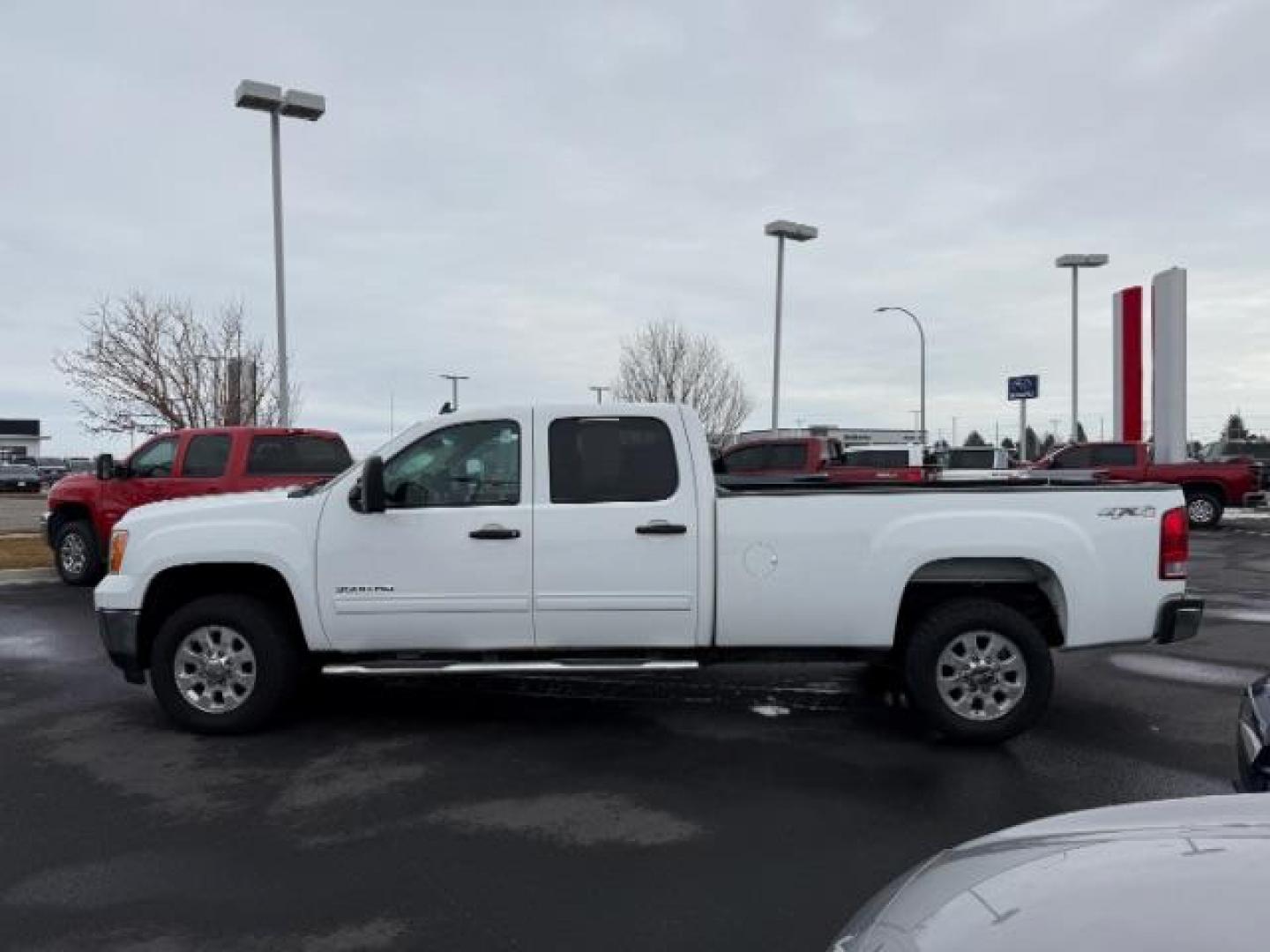 2013 Summit White /Ebony Cloth Interior GMC Sierra 3500HD SLE Crew Cab Long Box 4WD (1GT423C80DF) with an 6.6L V8 32V OHV DIESEL engine, 6-Speed Automatic transmission, located at 1235 N Woodruff Ave., Idaho Falls, 83401, (208) 523-1053, 43.507172, -112.000488 - Photo#1