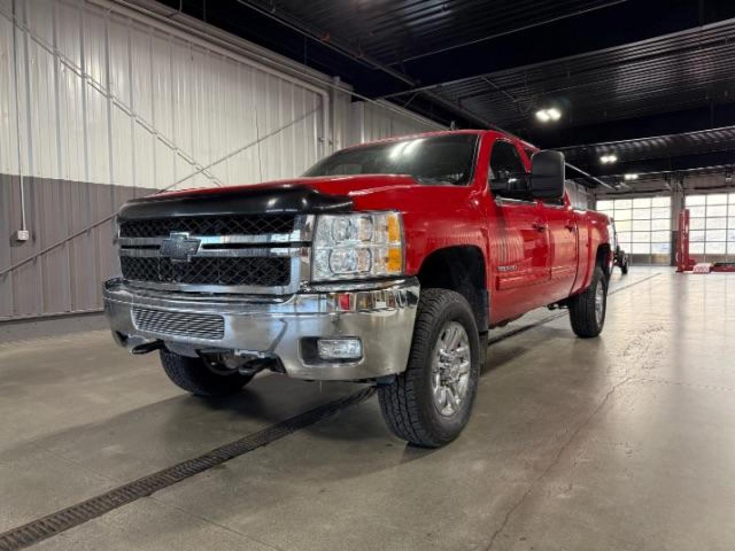 2013 Victory Red /Ebony Leather Interior Chevrolet Silverado 3500HD LTZ Crew Cab 4WD (1GC4K1E80DF) with an 6.6L V8 OHV 32V TURBO DIESEL engine, 6-Speed Automatic transmission, located at 1235 N Woodruff Ave., Idaho Falls, 83401, (208) 523-1053, 43.507172, -112.000488 - Photo#0