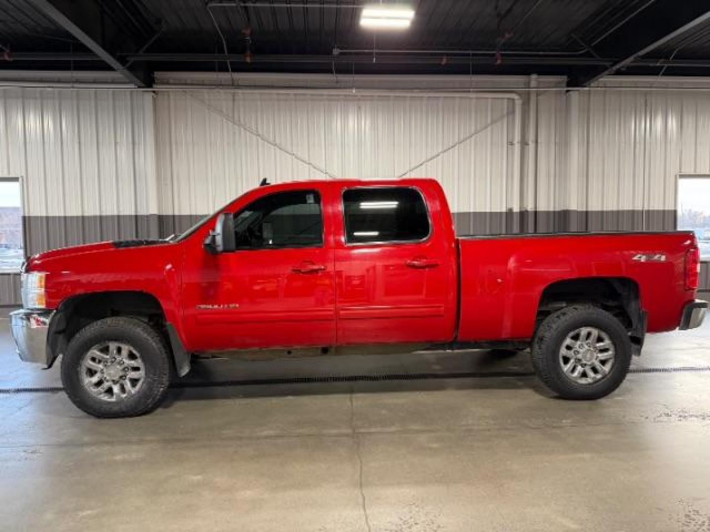 2013 Victory Red /Ebony Leather Interior Chevrolet Silverado 3500HD LTZ Crew Cab 4WD (1GC4K1E80DF) with an 6.6L V8 OHV 32V TURBO DIESEL engine, 6-Speed Automatic transmission, located at 1235 N Woodruff Ave., Idaho Falls, 83401, (208) 523-1053, 43.507172, -112.000488 - Photo#1